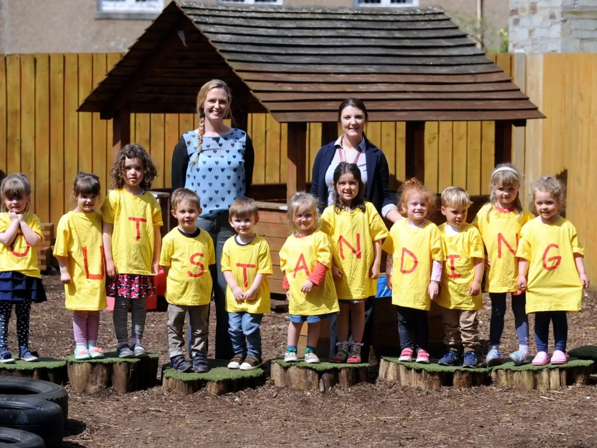 a group of children posing for a photo