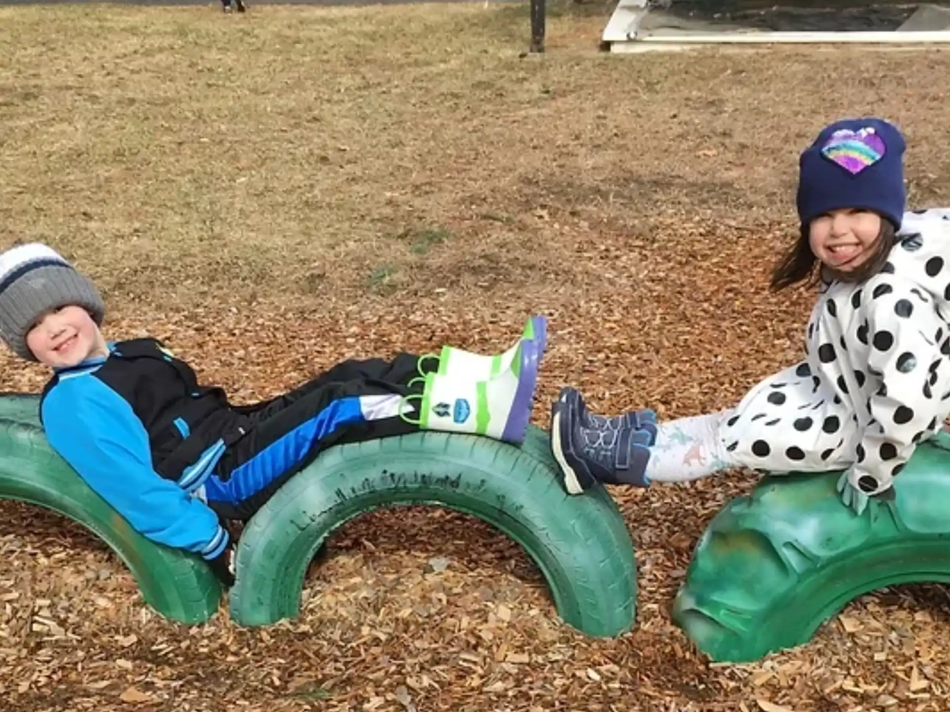 two kids on a toy horse