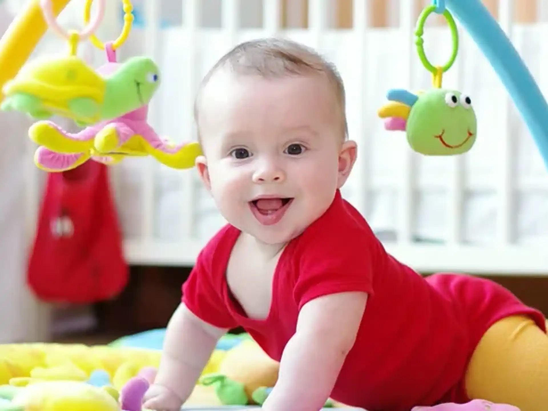 a baby in a red shirt