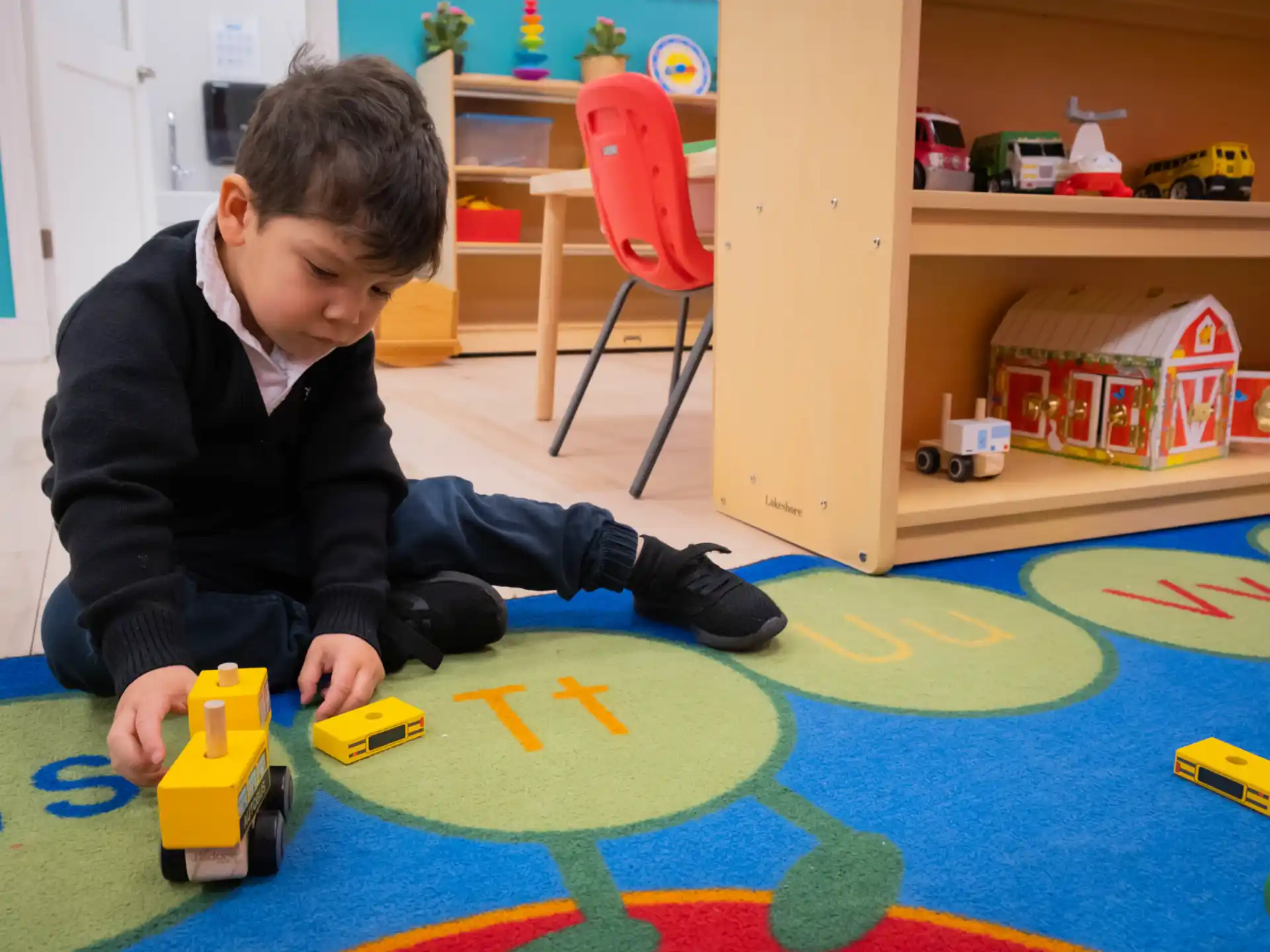 a boy playing with toys