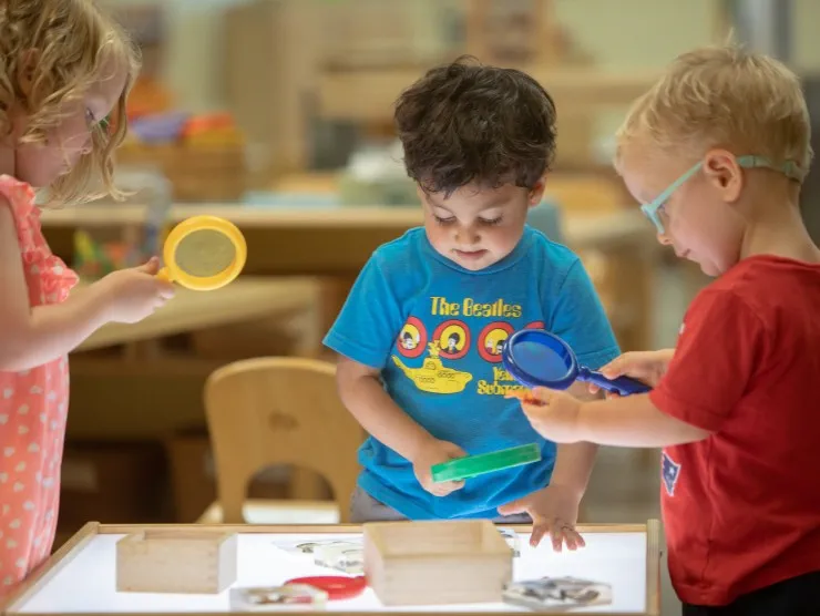 a group of children playing with a toy