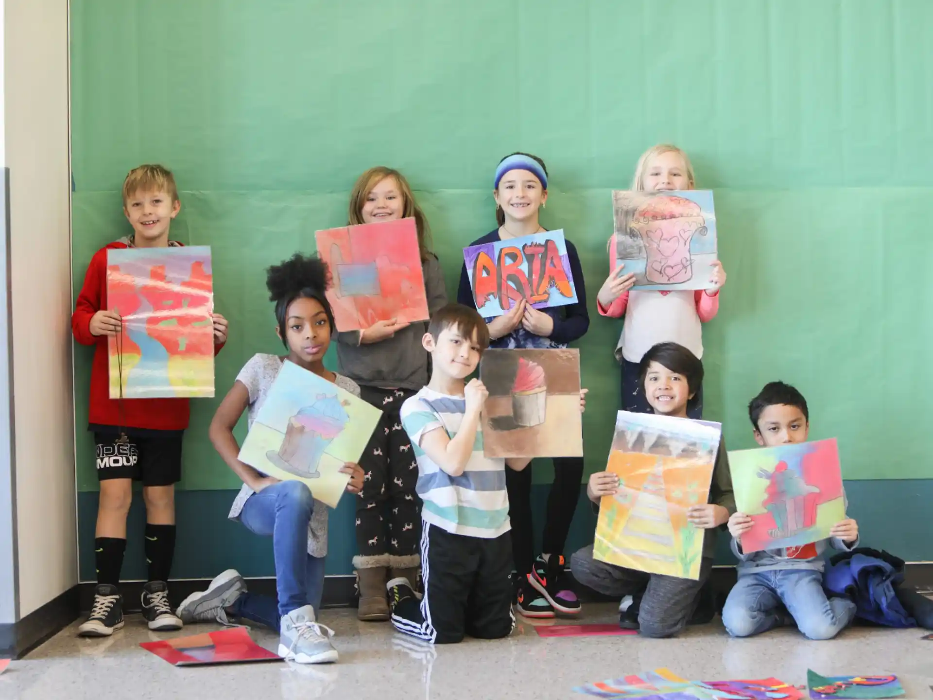 a group of children holding books