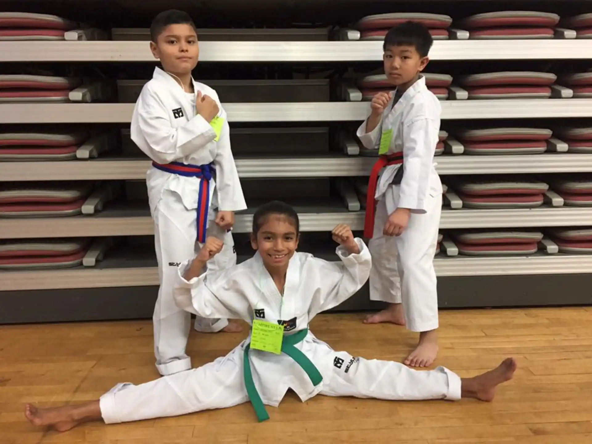 a group of boys in karate uniforms