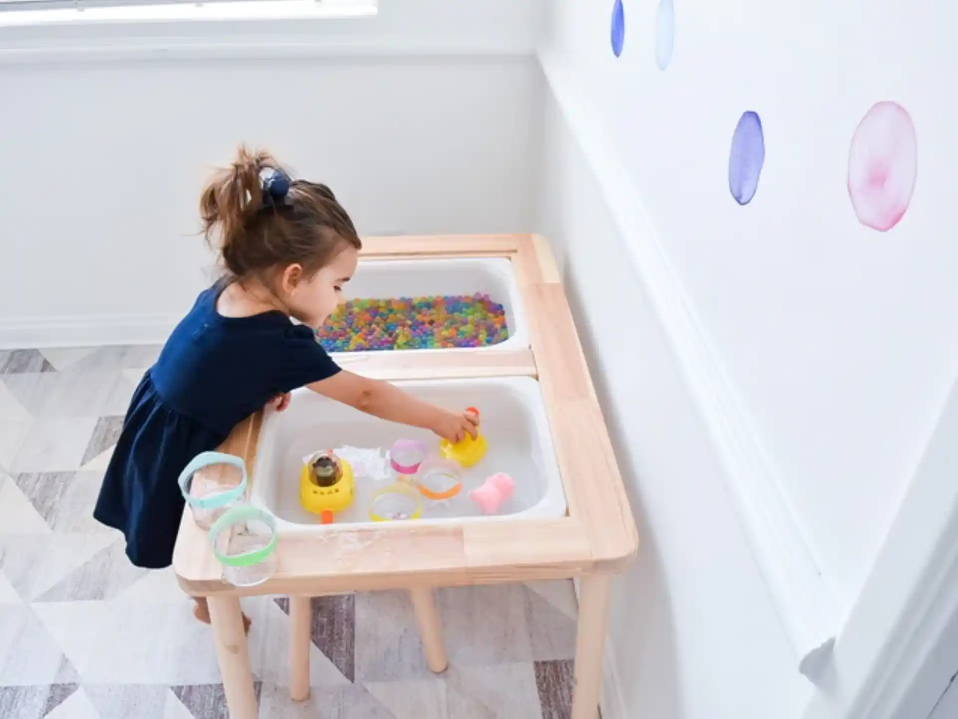 a girl painting on a table
