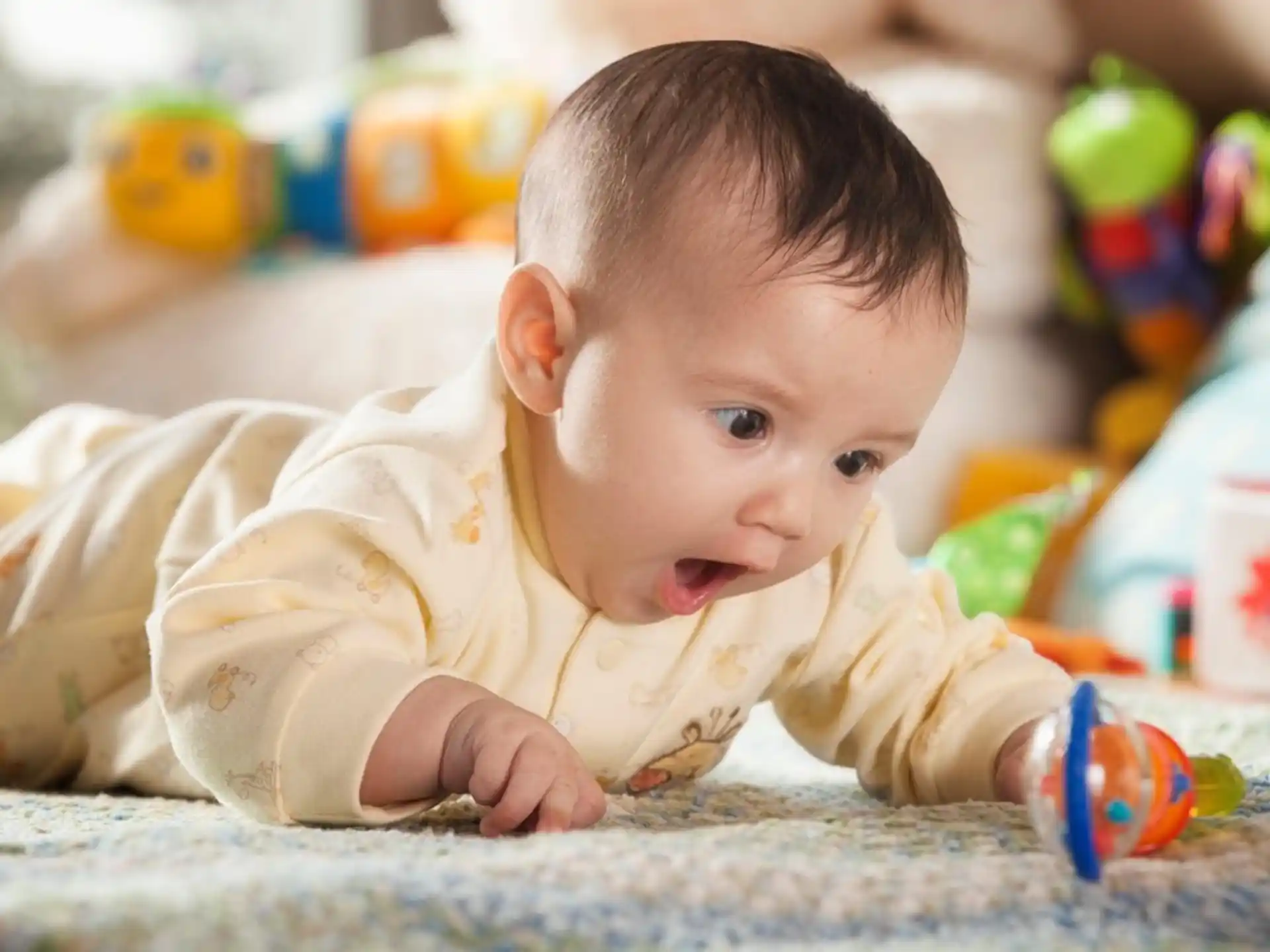 a baby crawling on the floor