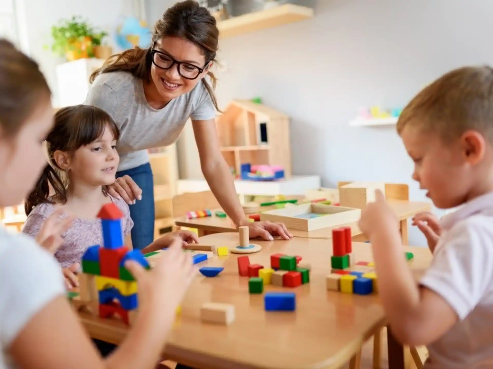 a person and children playing with toys