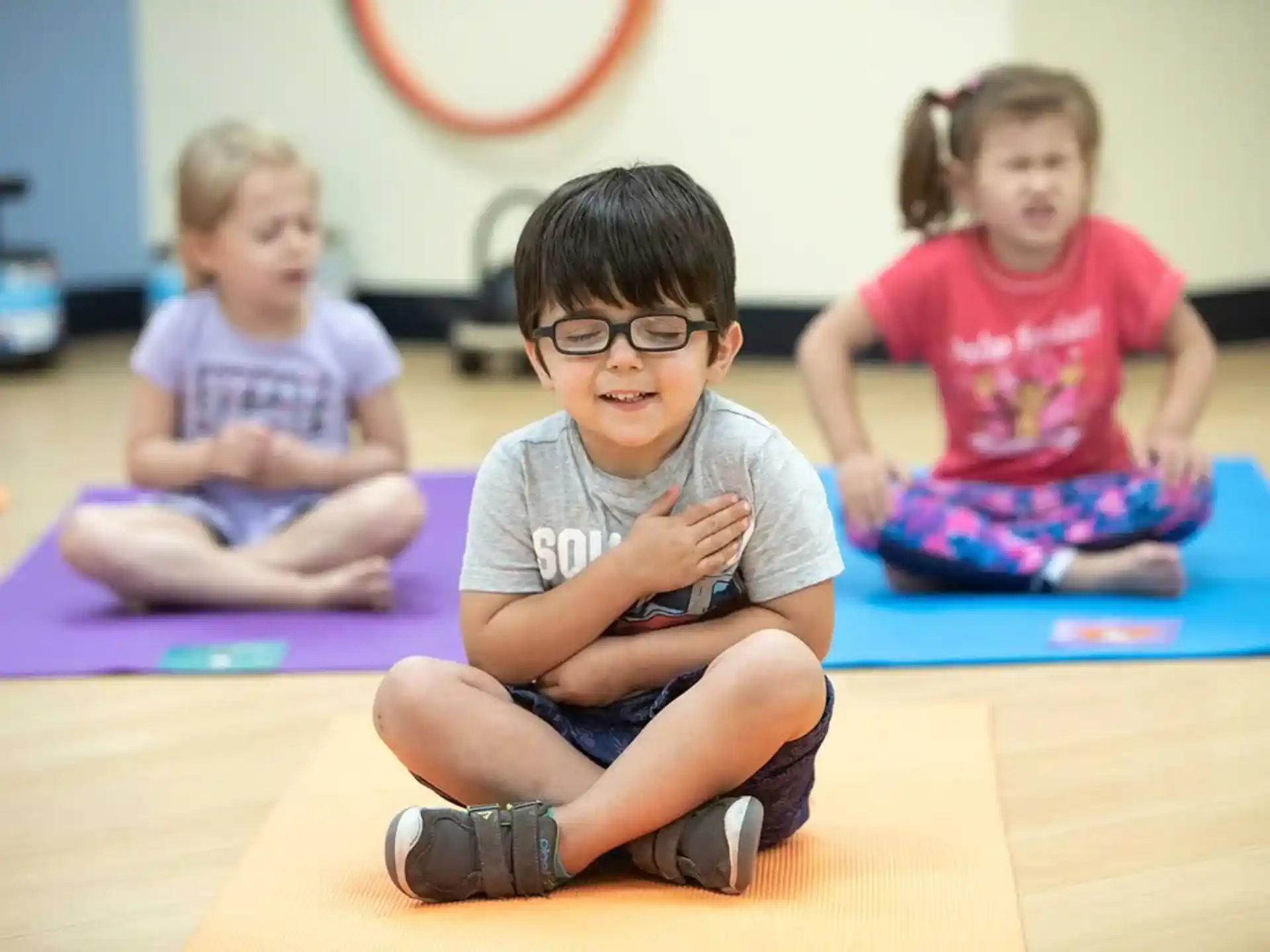 a group of children sitting on the floor