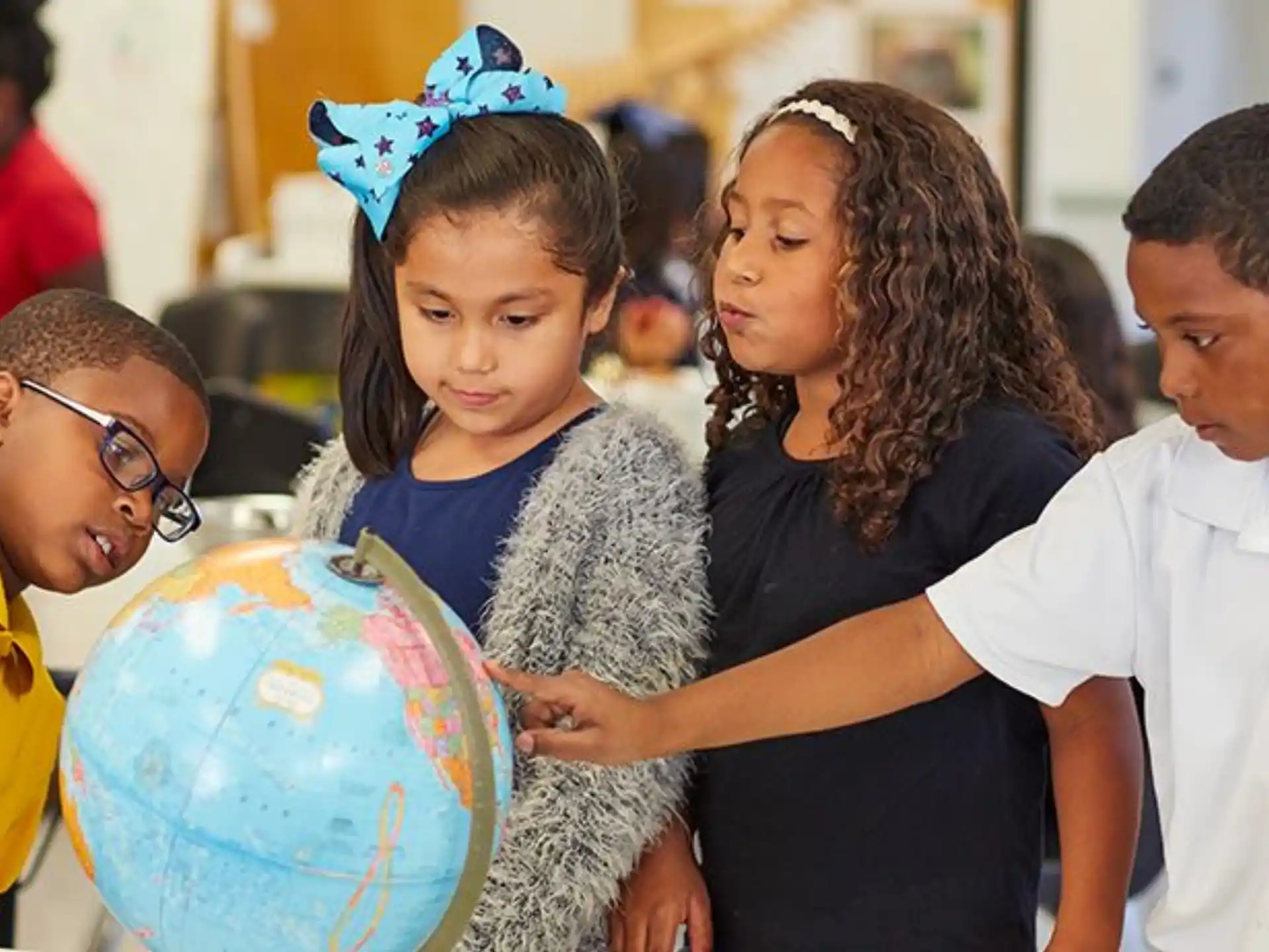 a group of people around a globe