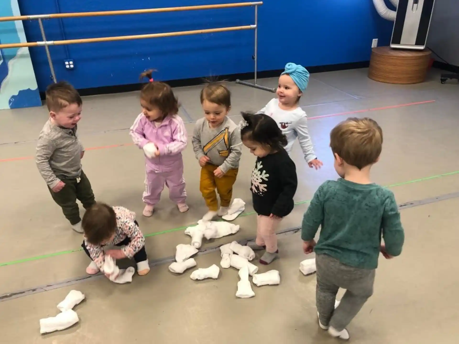 a group of children playing with toys