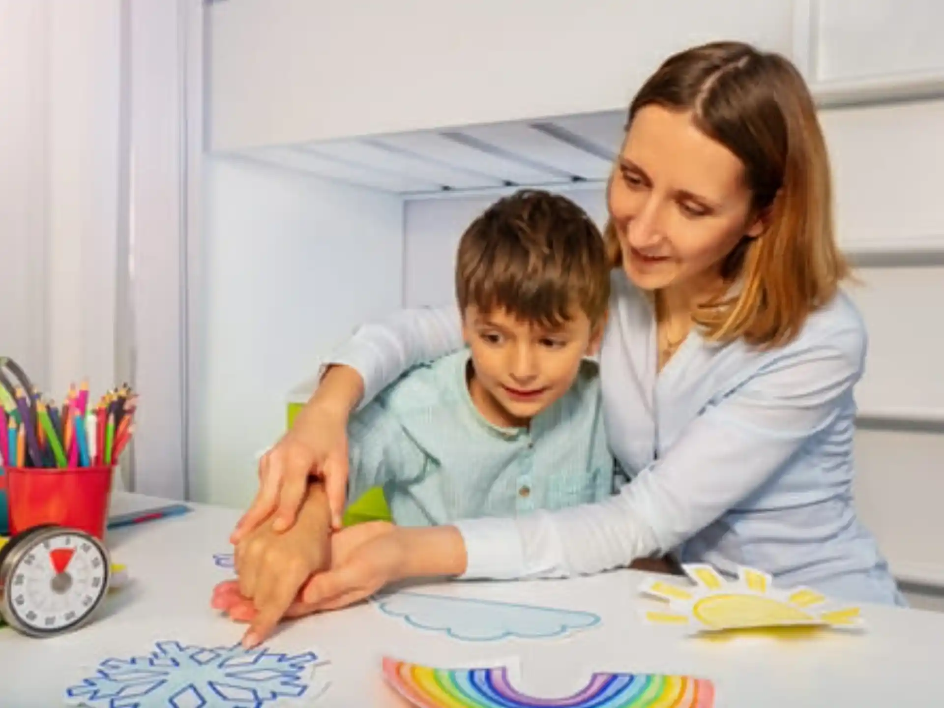 a person and a child painting