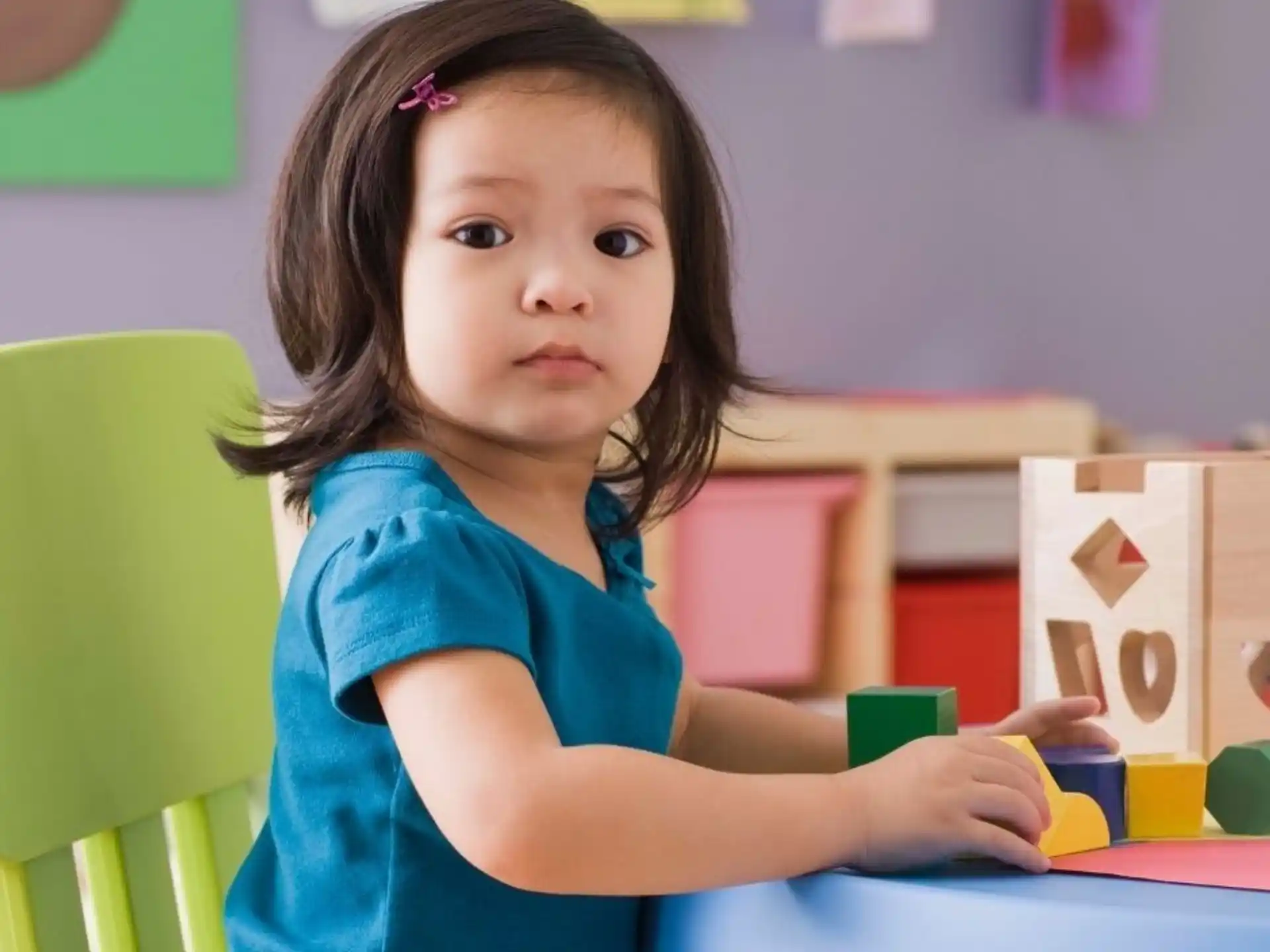 a girl sitting at a desk