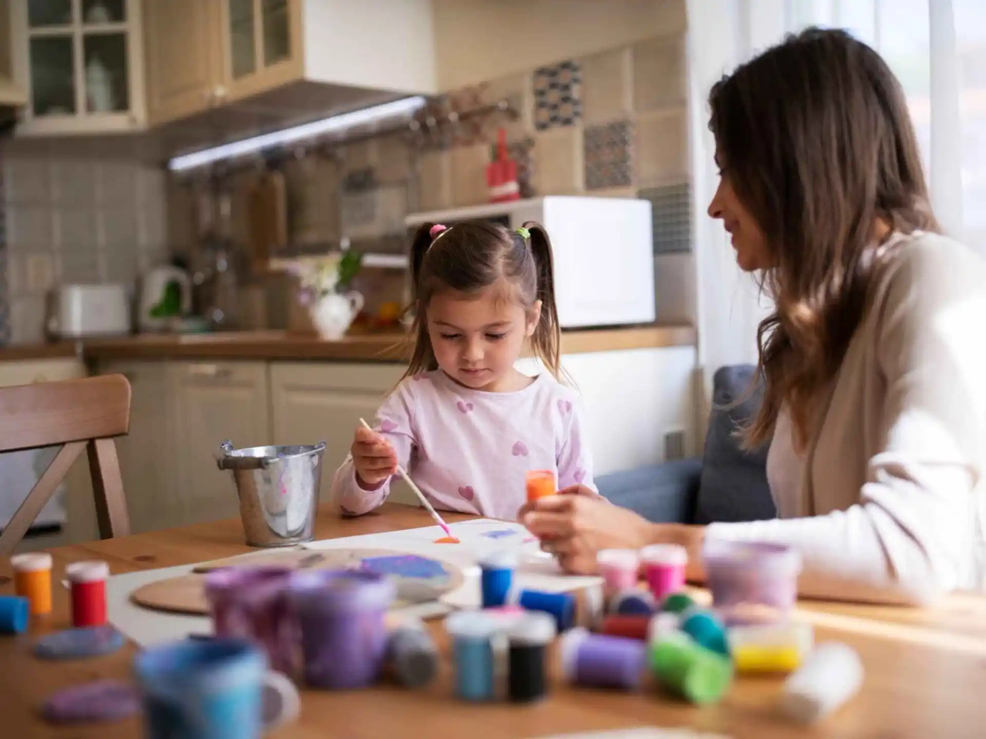 a person and a child painting