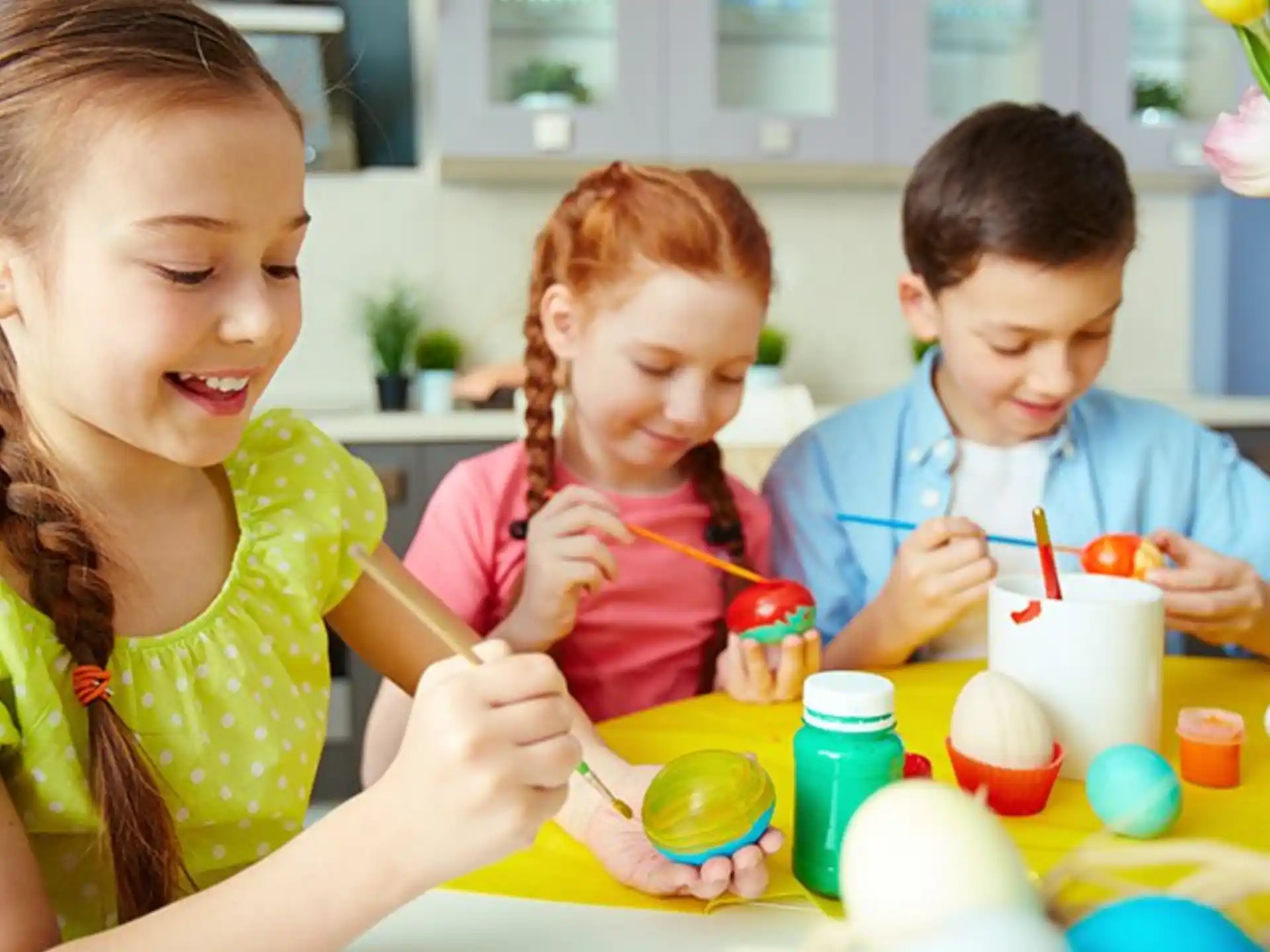 a group of children painting