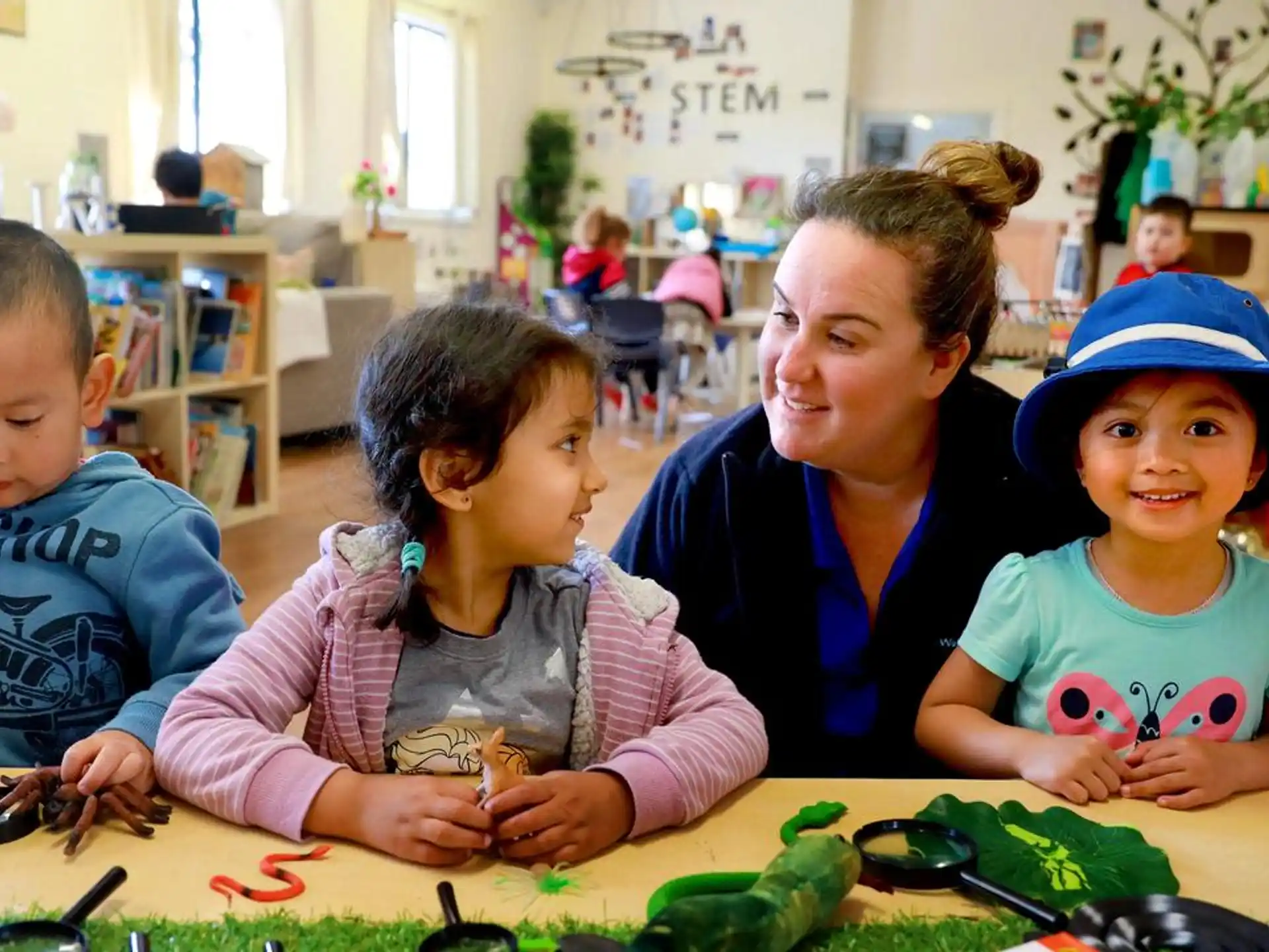 a person and children sitting at a table