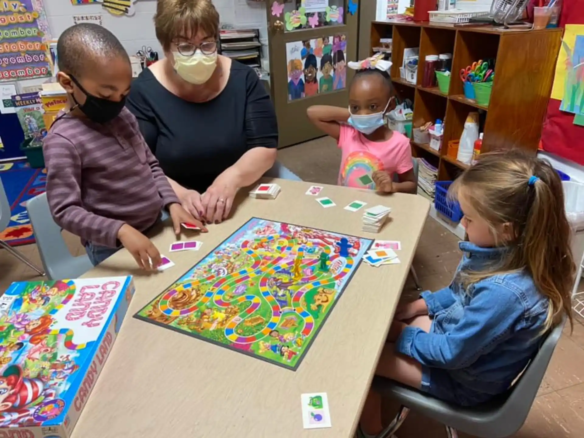 a group of children playing a board game