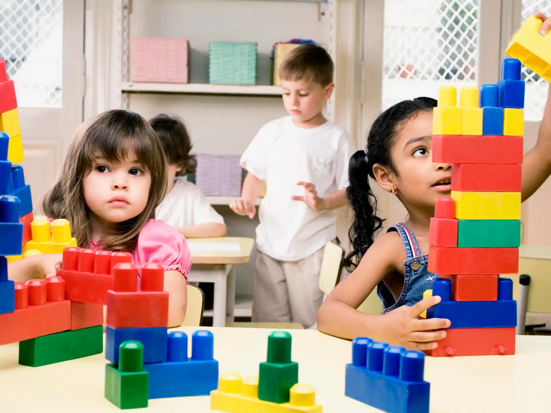 a group of children playing with toys