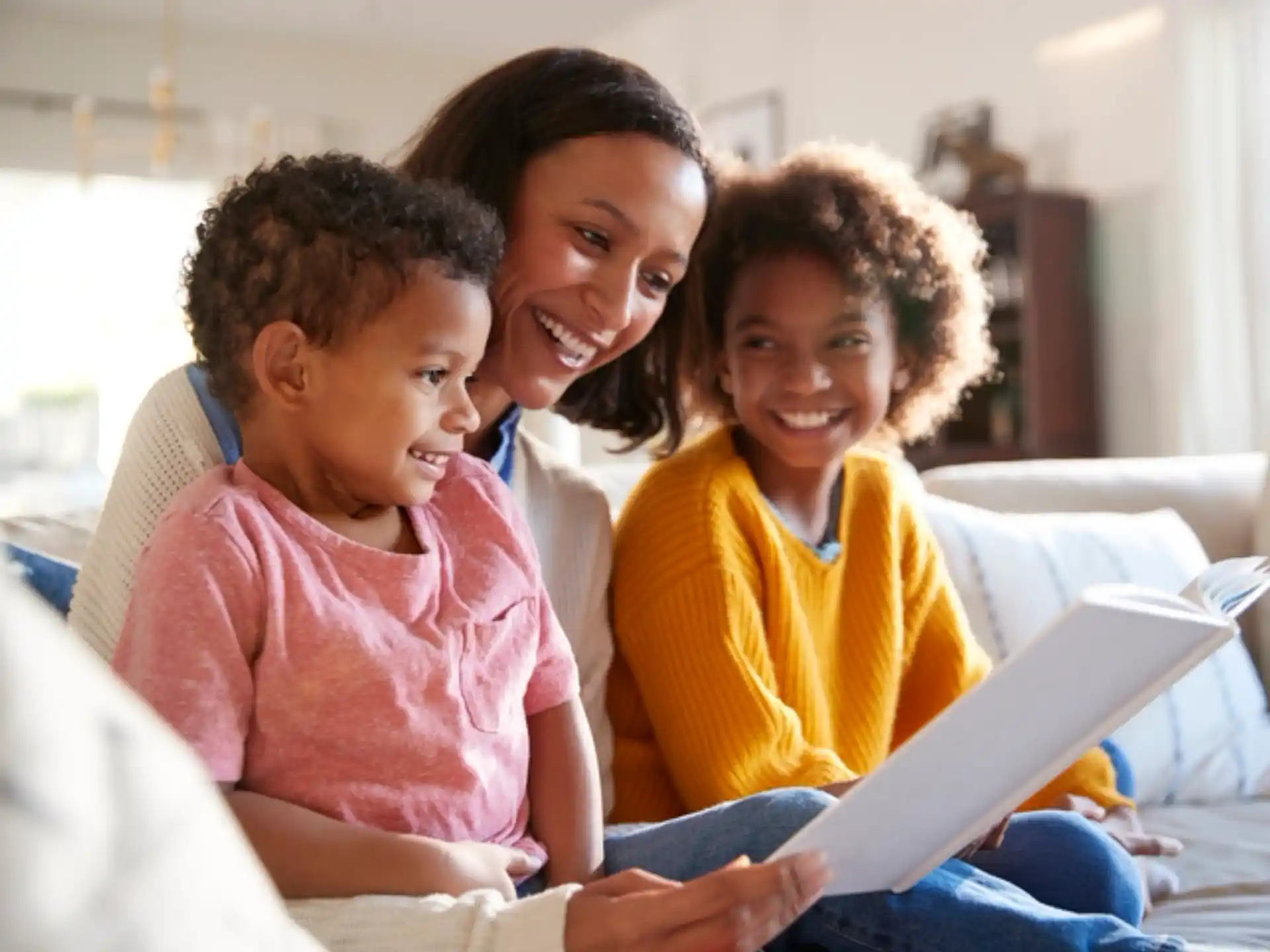 a family looking at a laptop