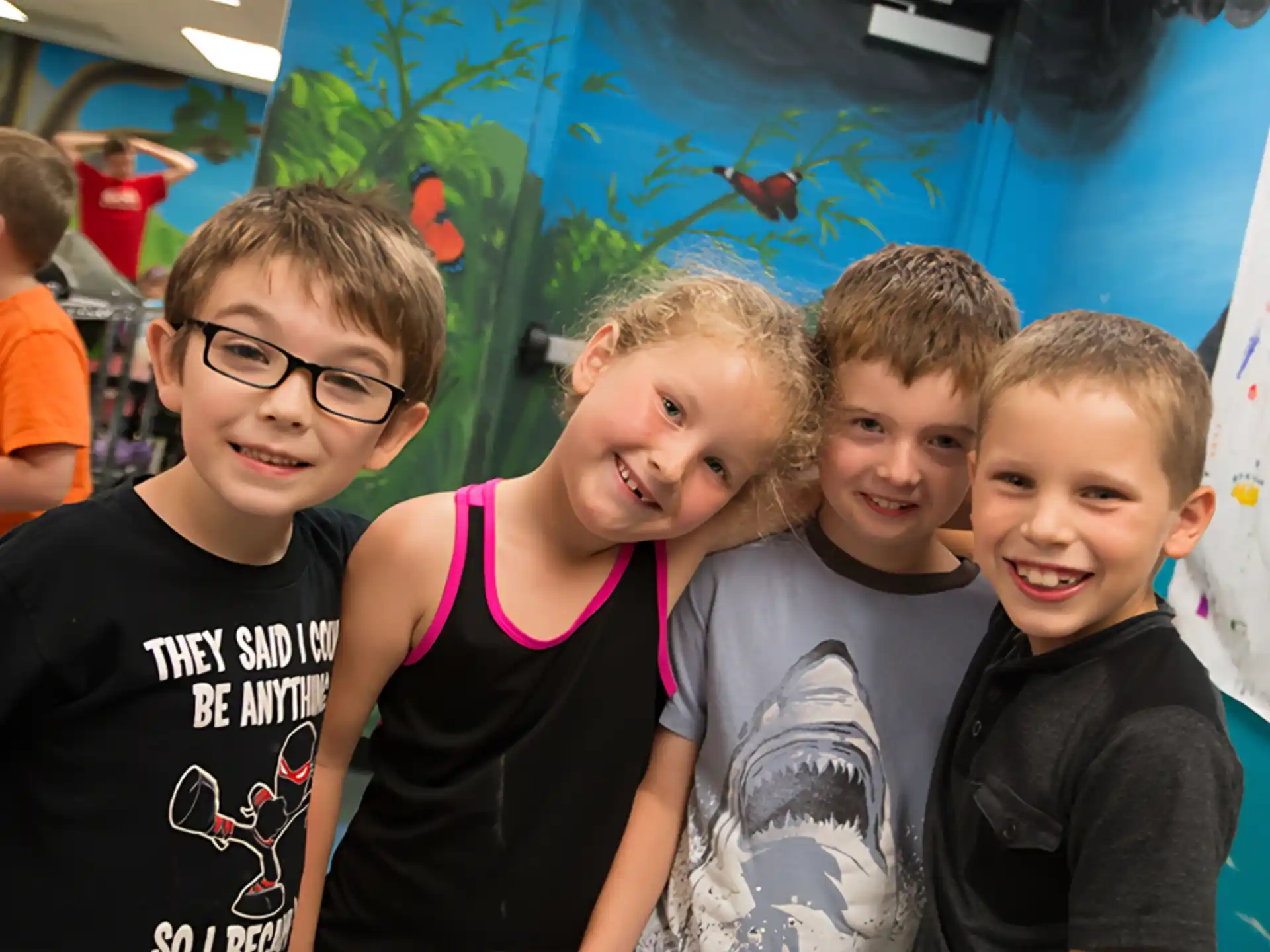 a group of kids posing for a photo