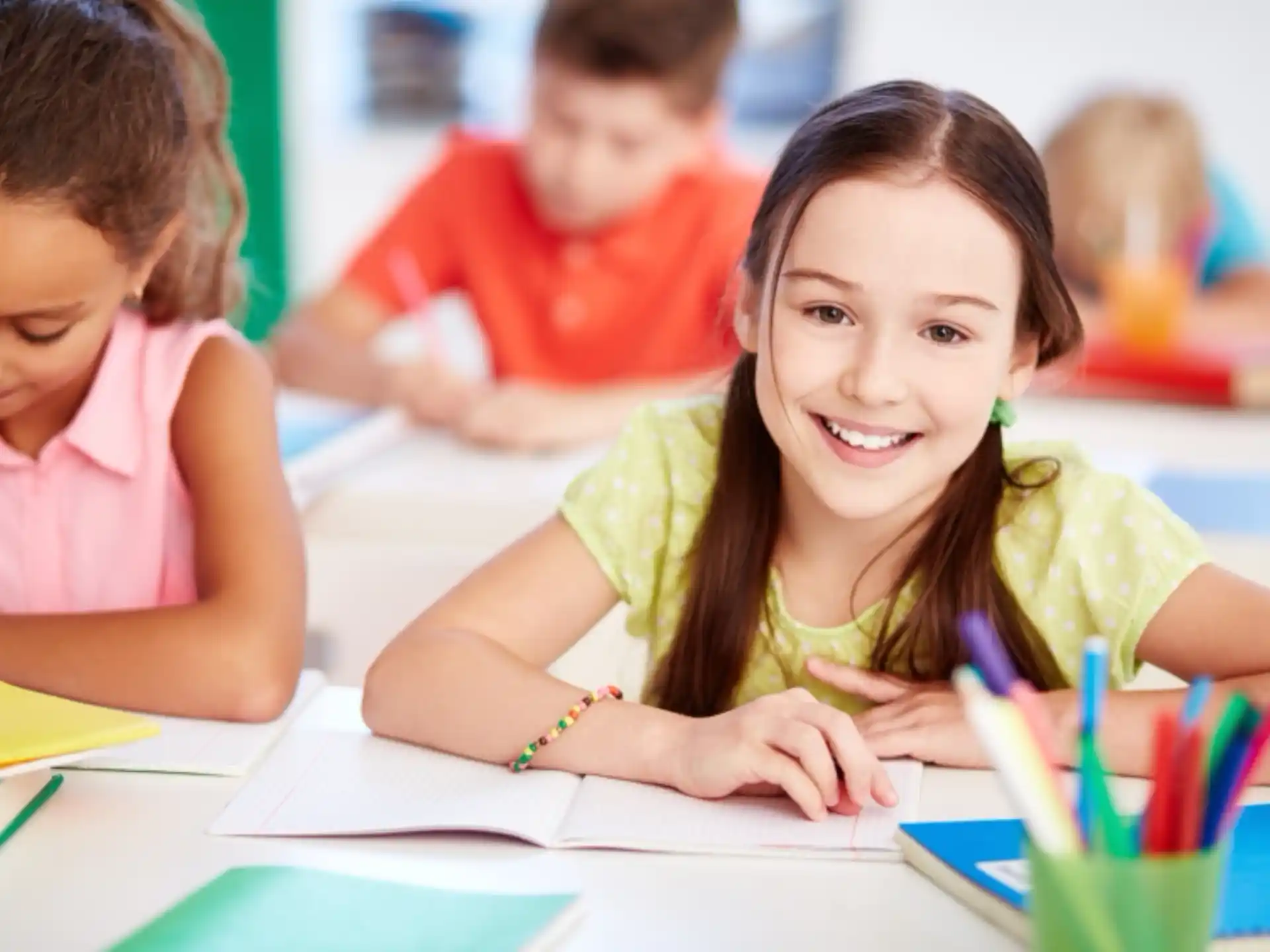 a few children sitting at a table
