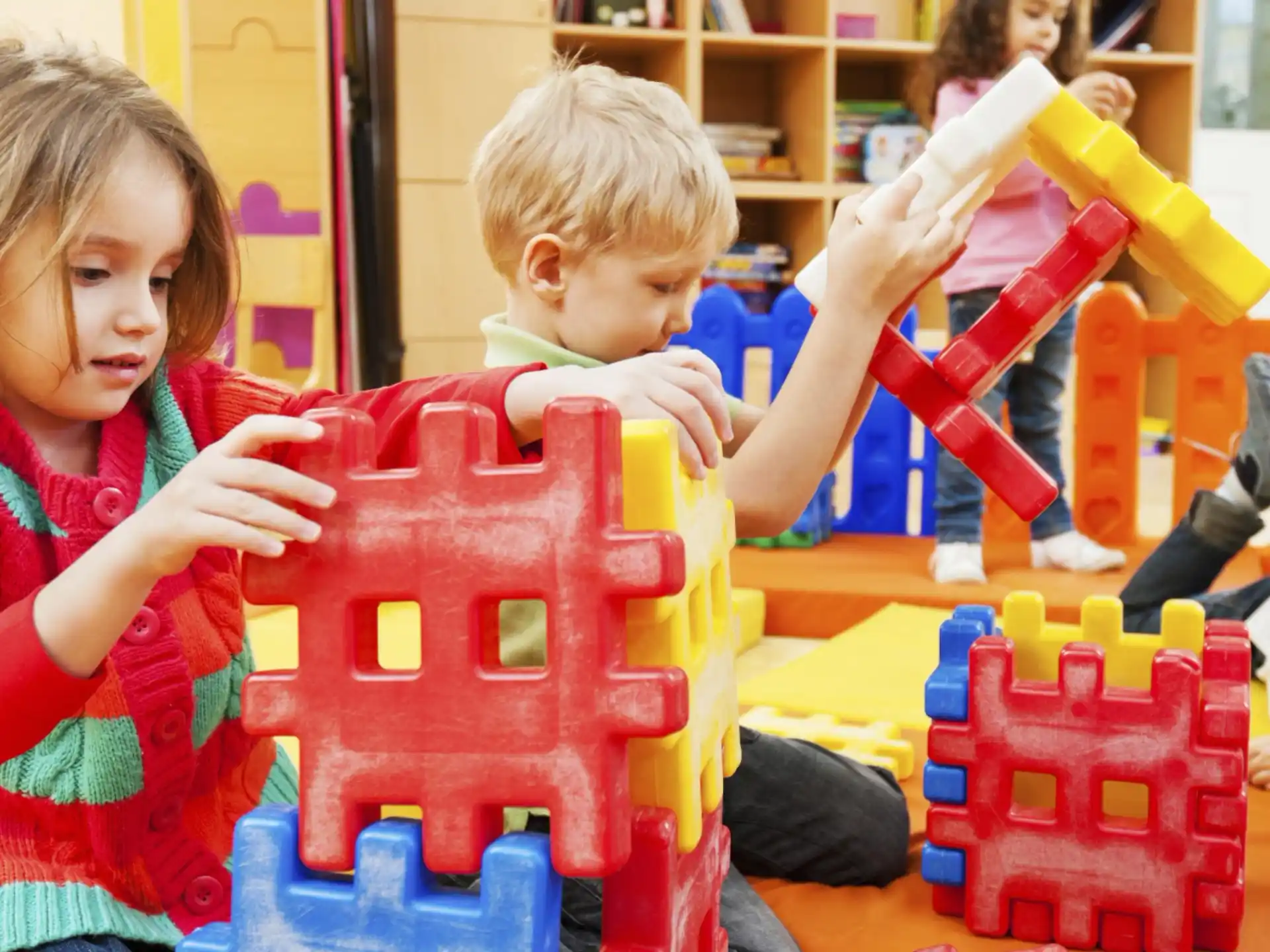 a couple of children playing with toys