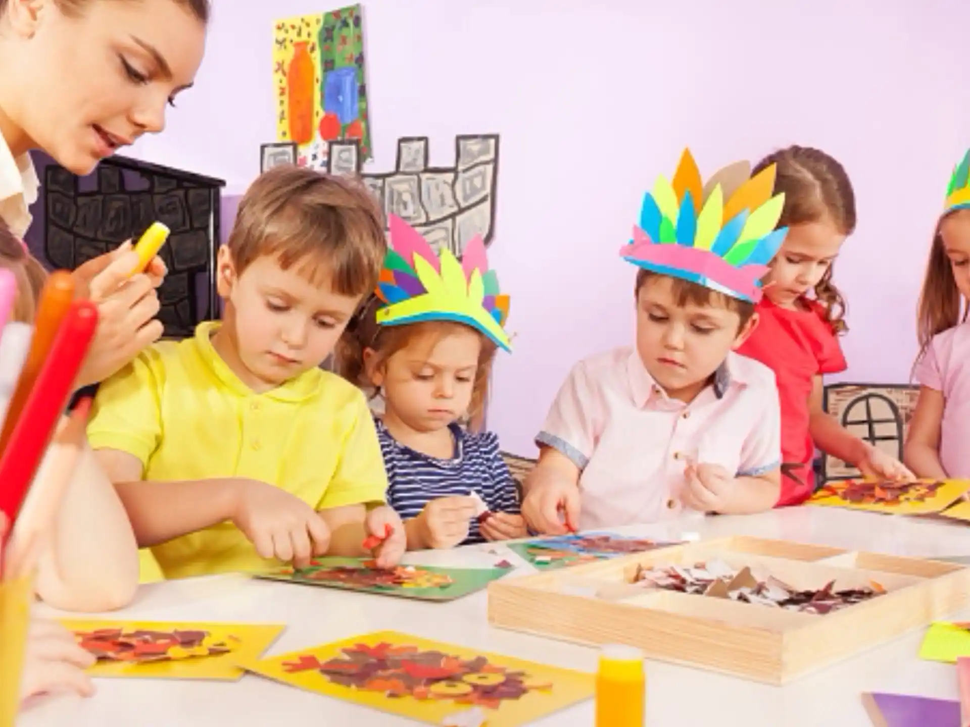 a group of children wearing party hats