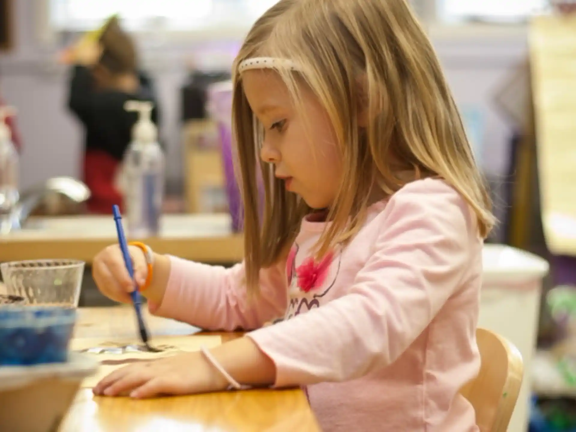 a young girl painting