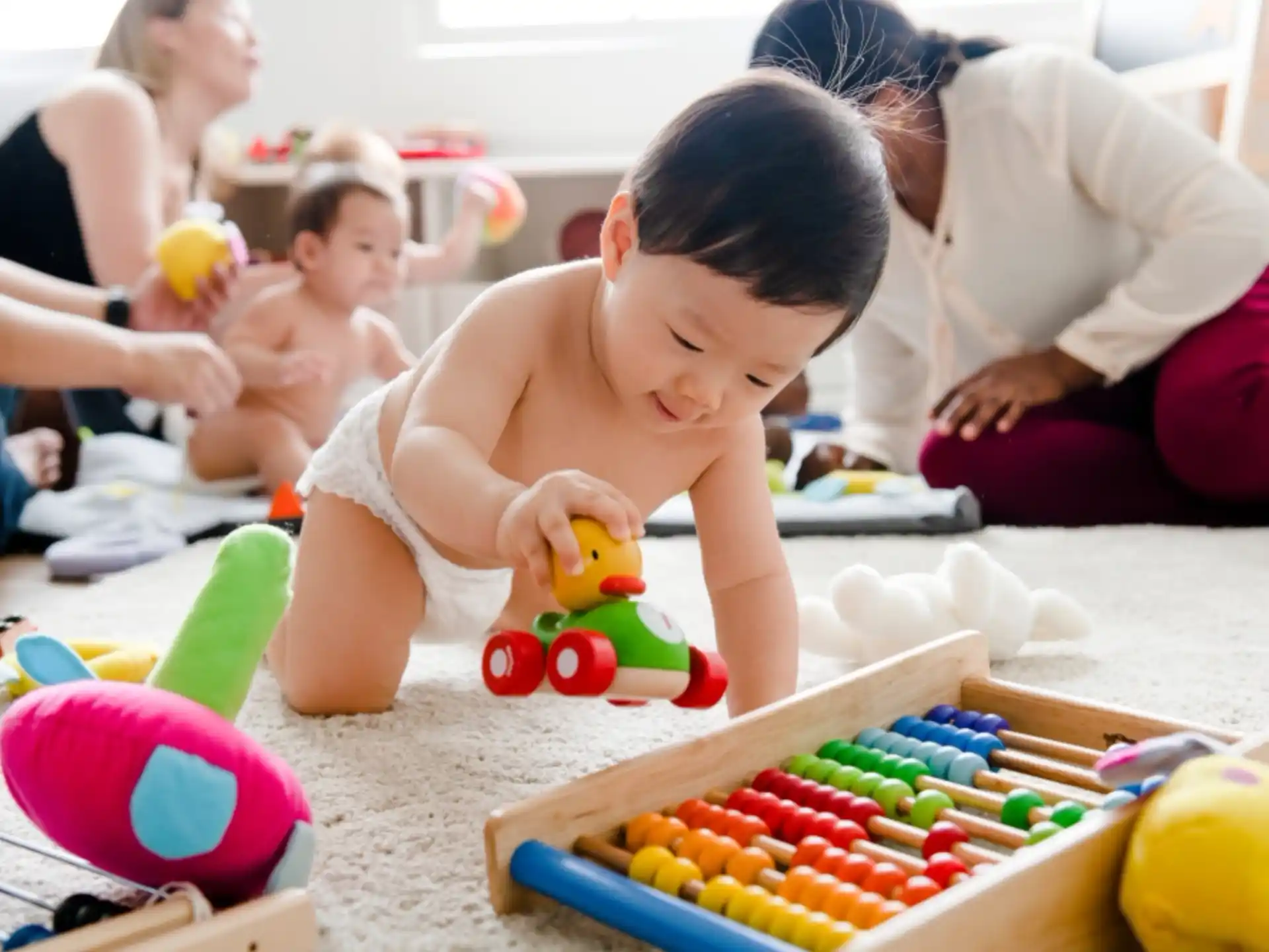a baby playing with toys