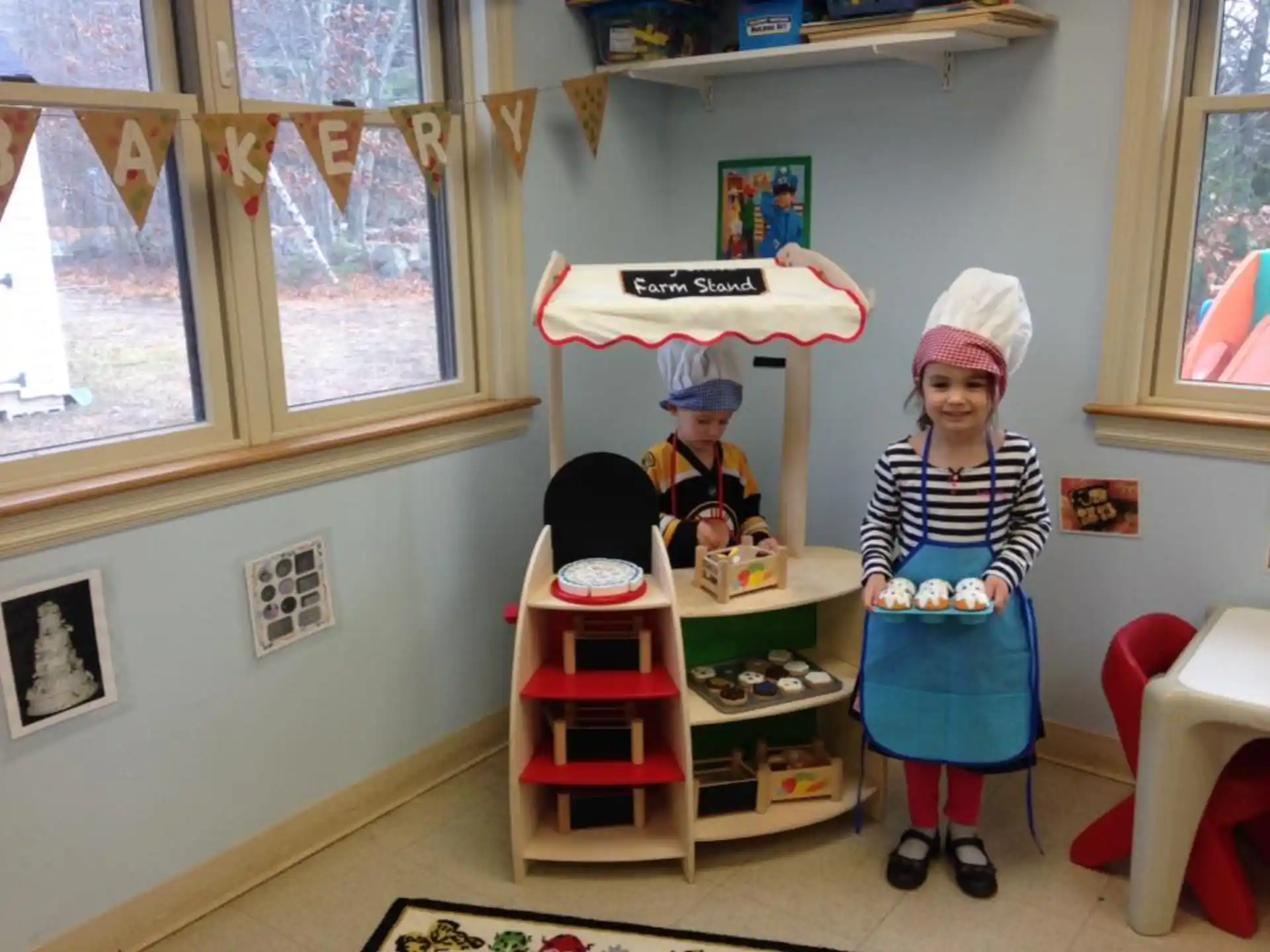 children in a room with a shelf