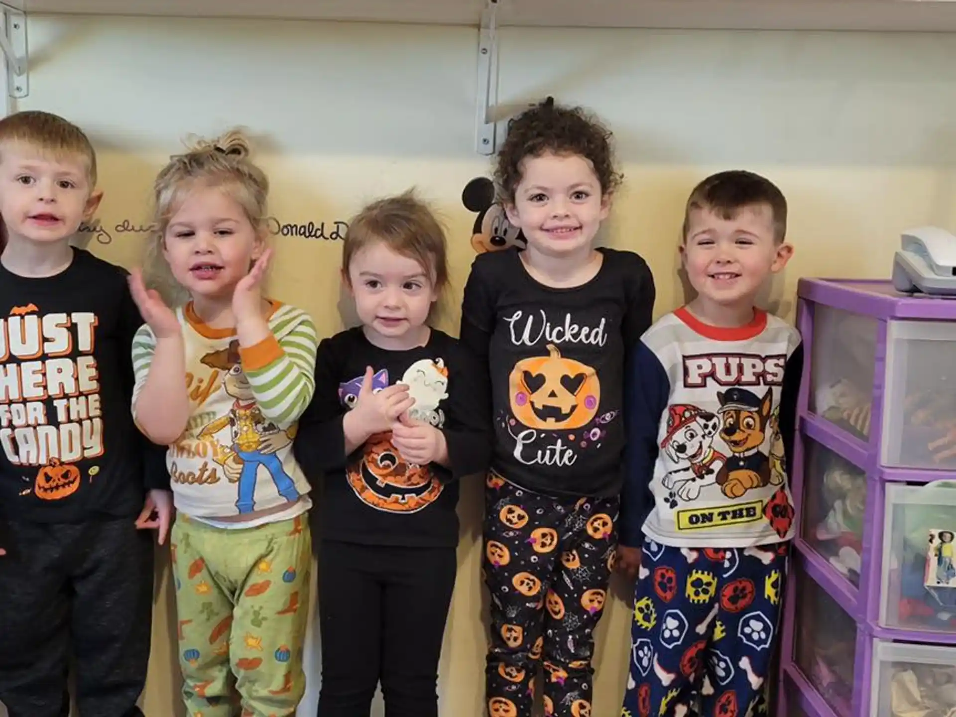 a group of children posing for a photo