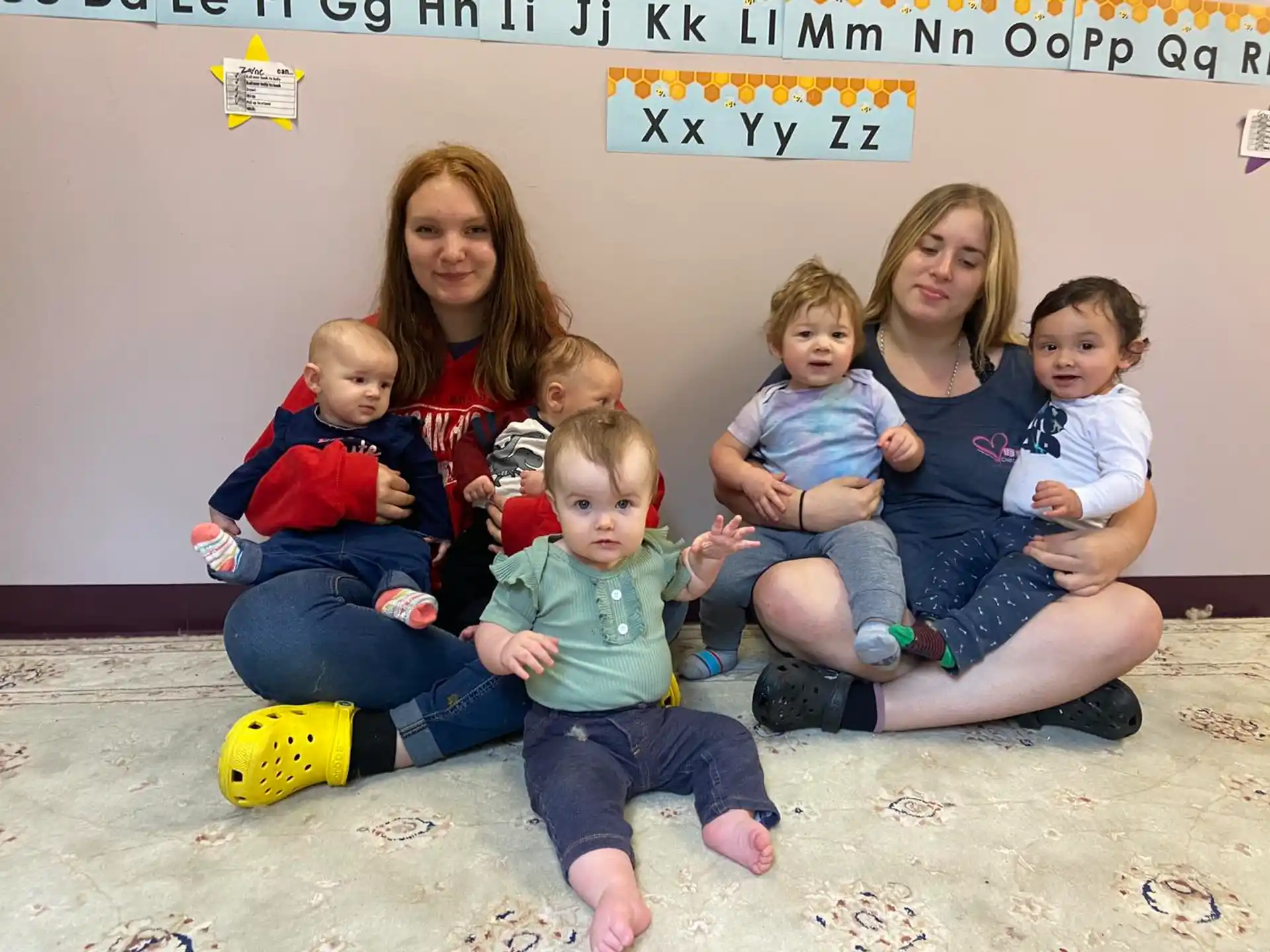 a group of children sitting on the floor