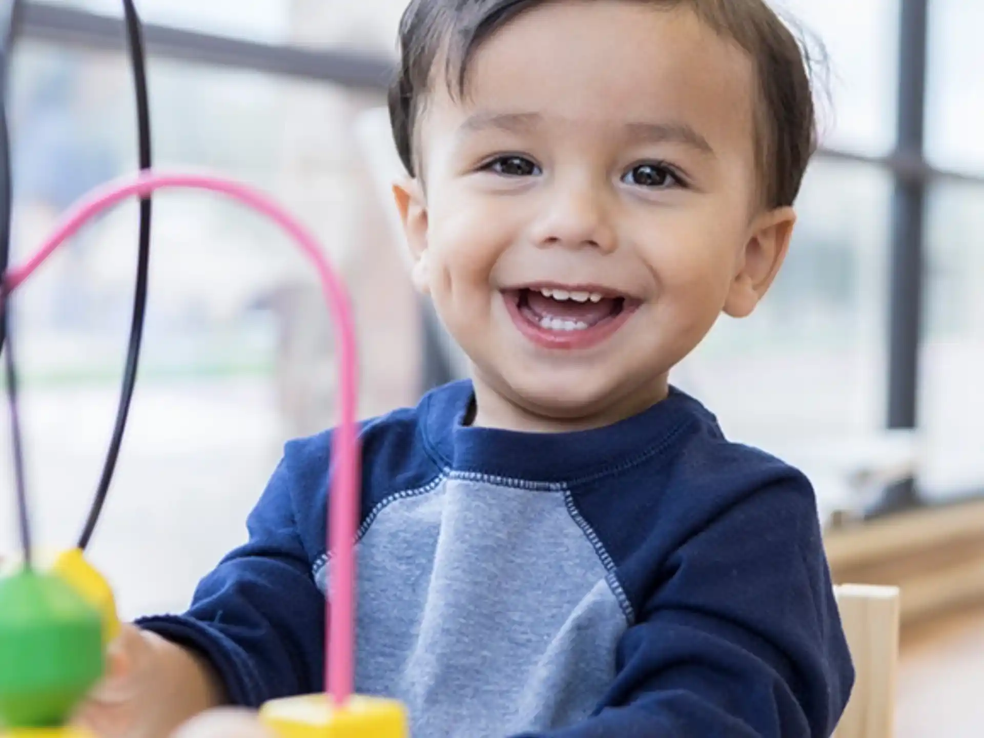 a child holding a toy