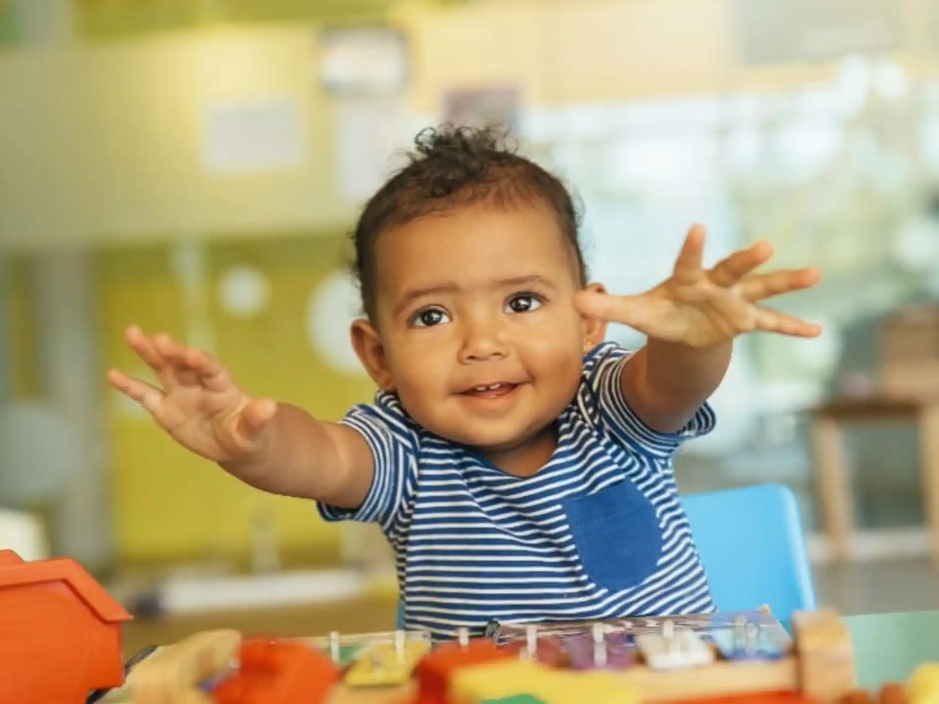 a child with his hands up