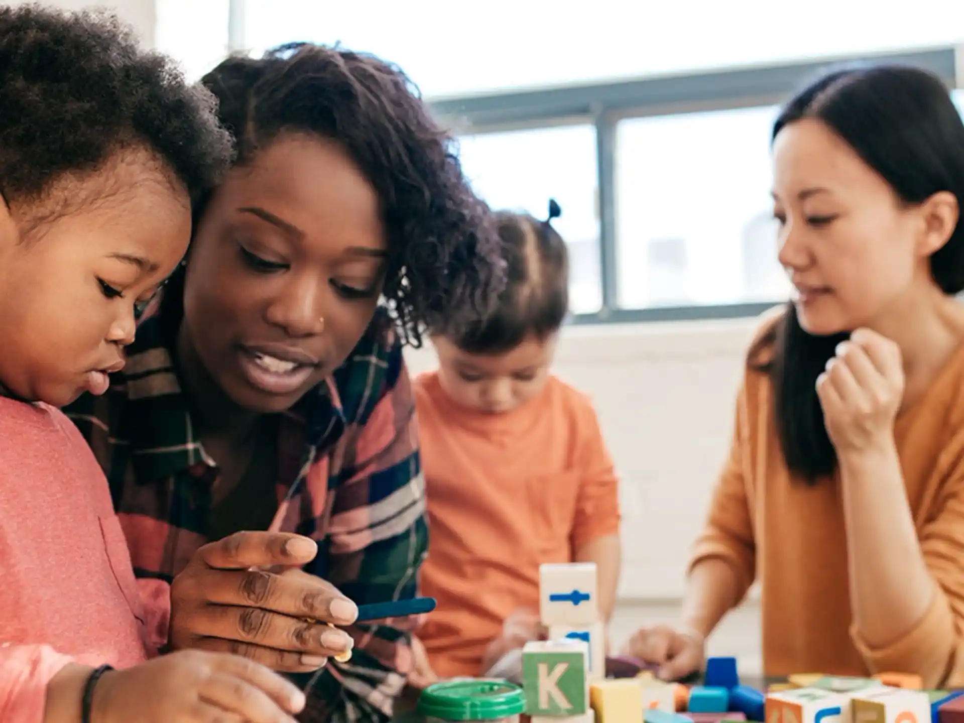 a group of women looking at a phone