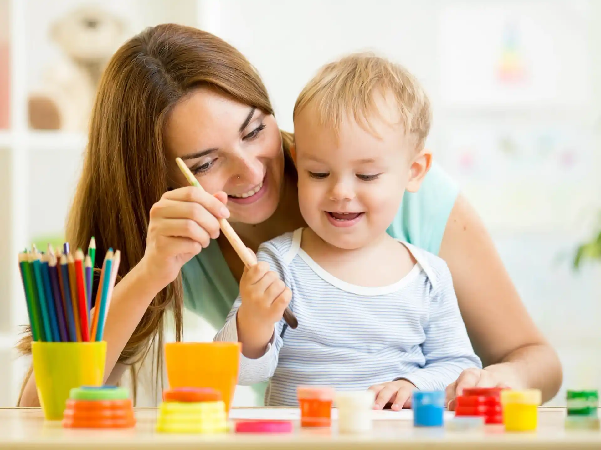 a person and a child painting