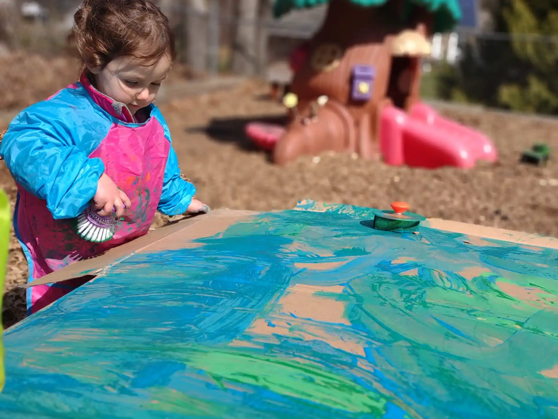 a child playing in a pool