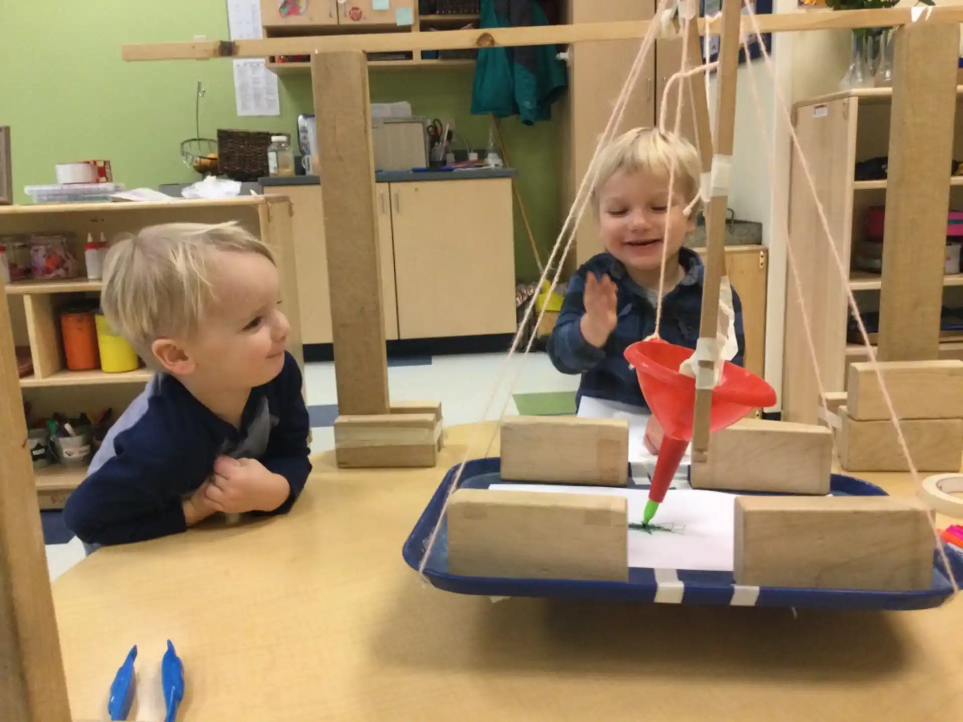 a couple of kids playing with building blocks