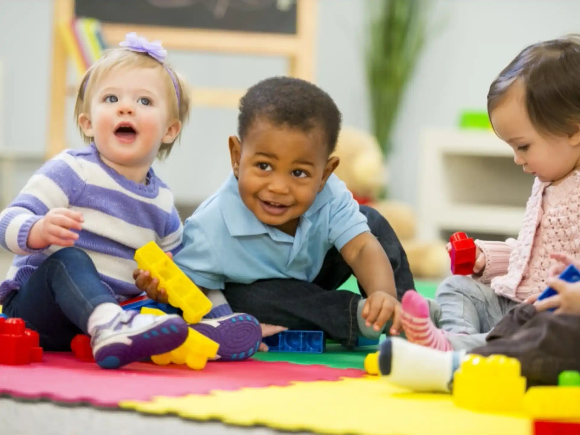 a group of children playing with toys