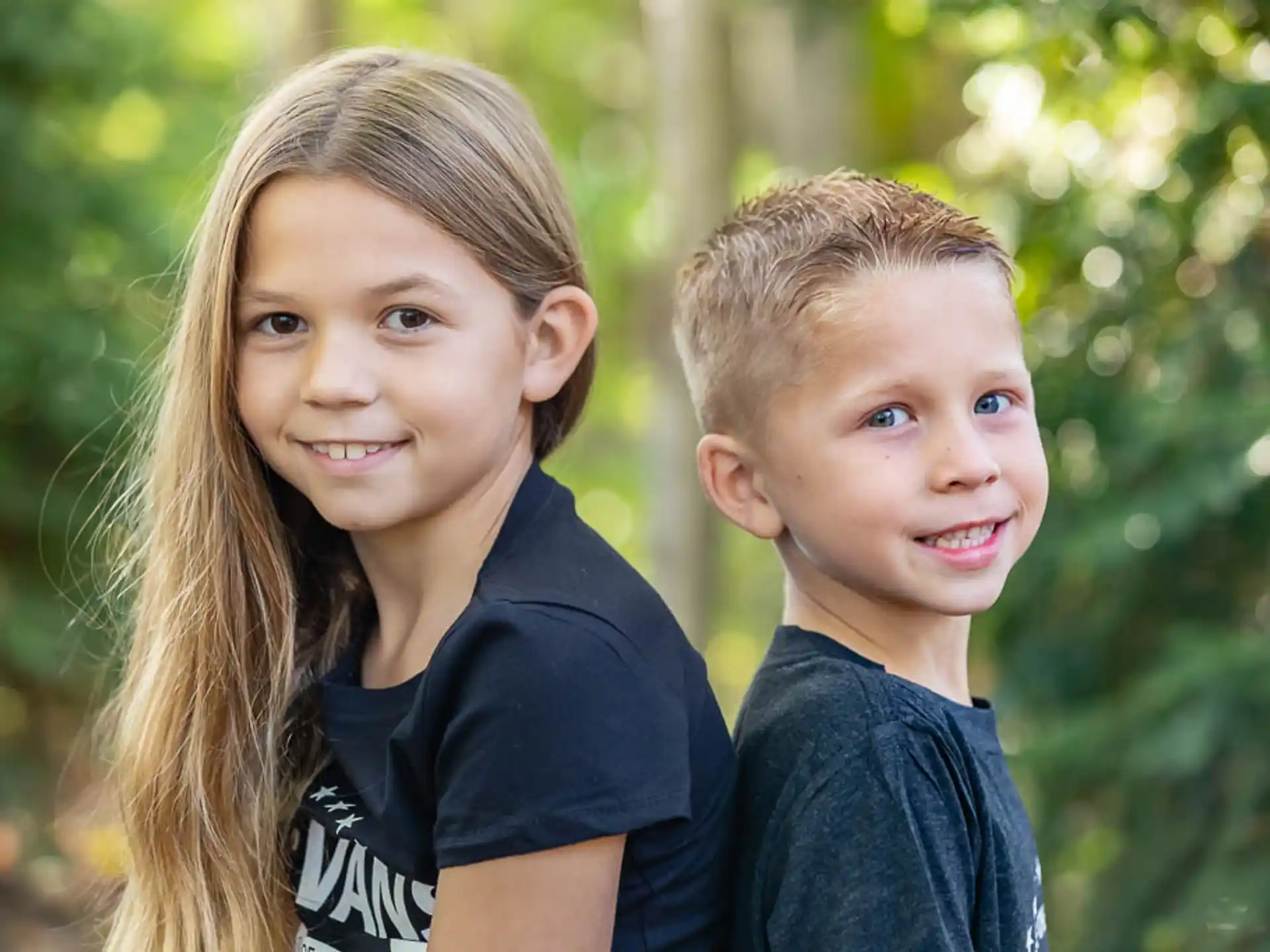 a couple of children smiling