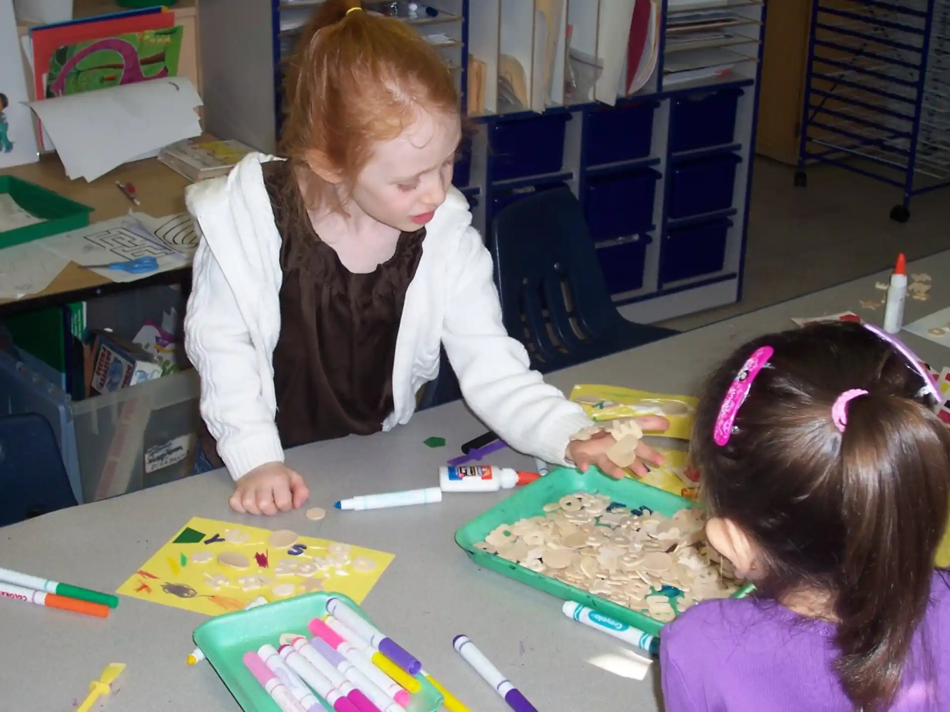 a few young girls painting