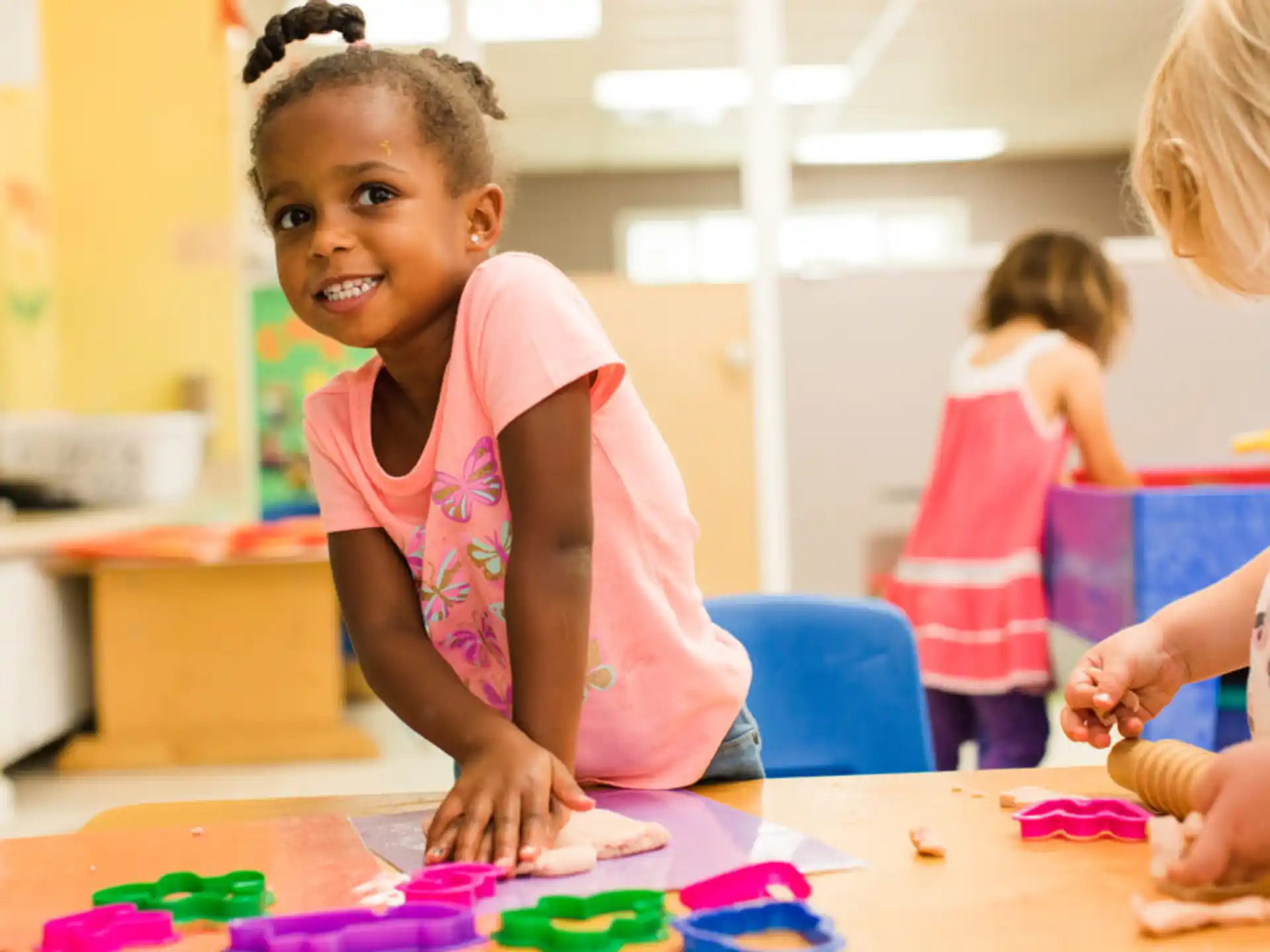 a young girl smiling