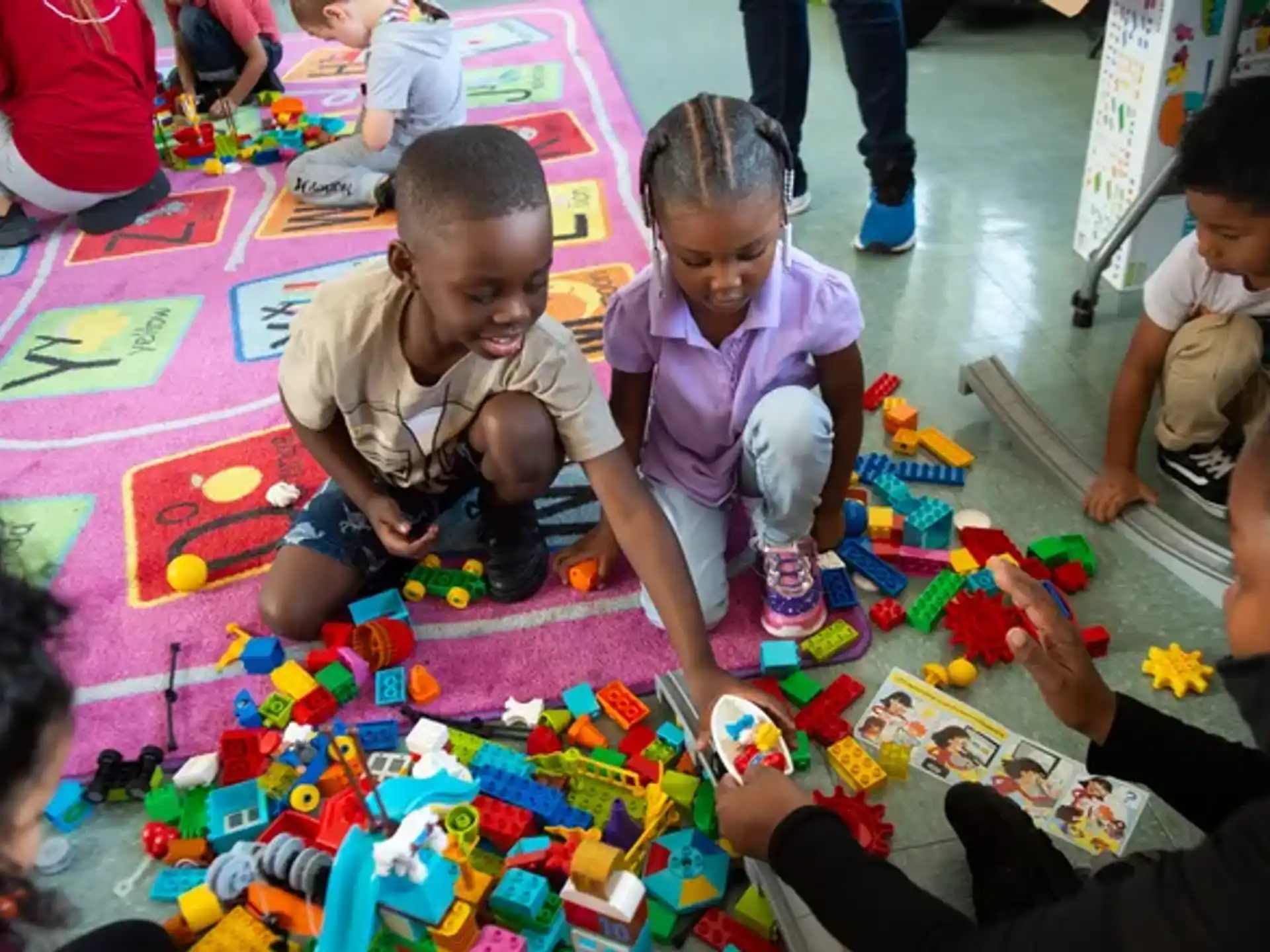 a group of children playing with toys