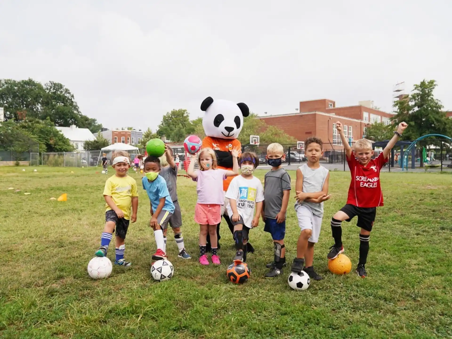 a group of kids playing football