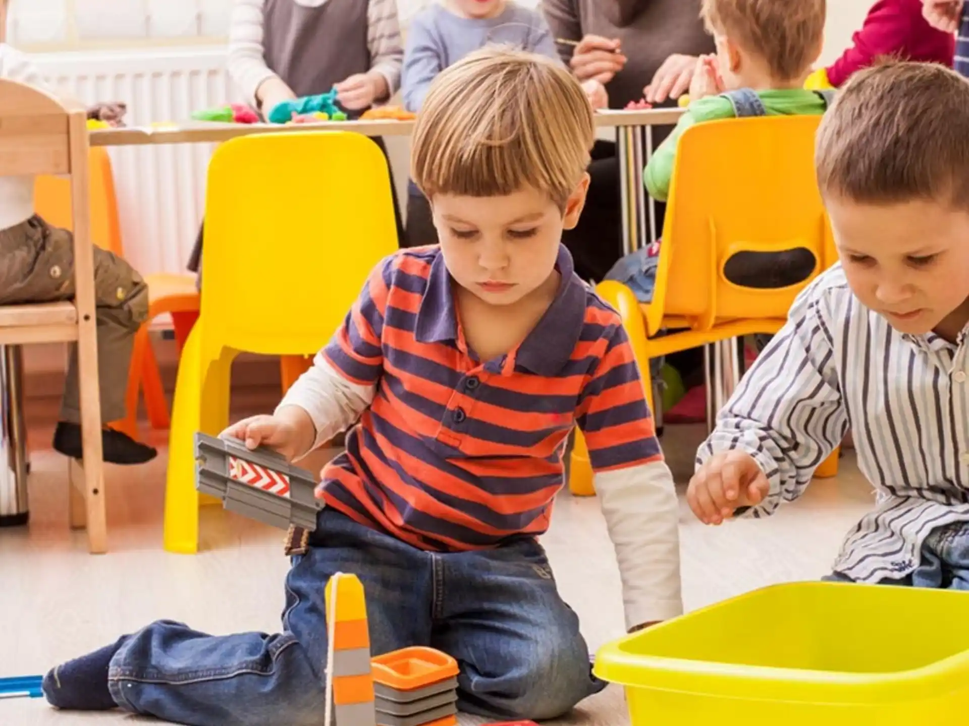a group of children playing with toys