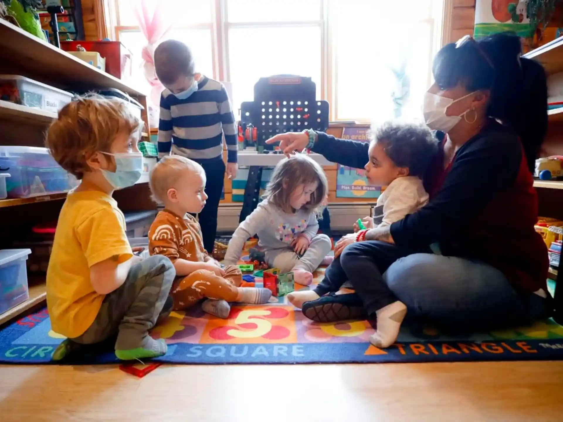 a group of children sitting on the floor
