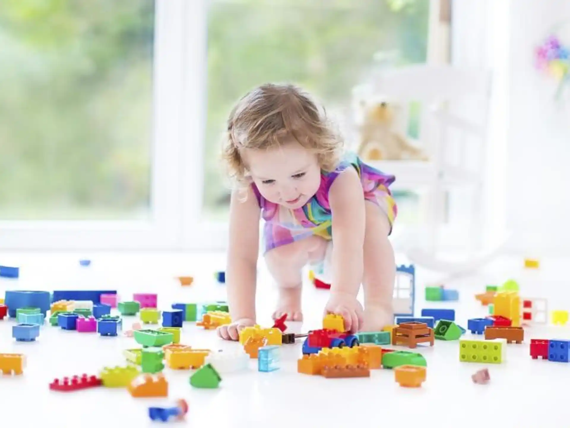 a baby playing with toys