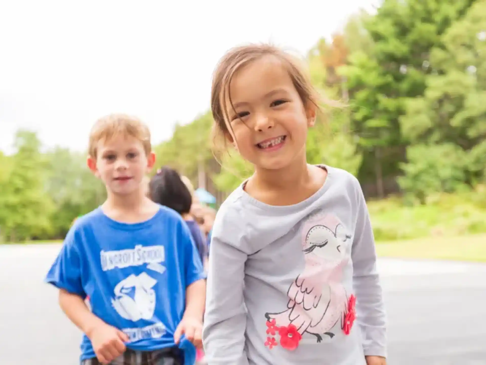 a couple of children smiling