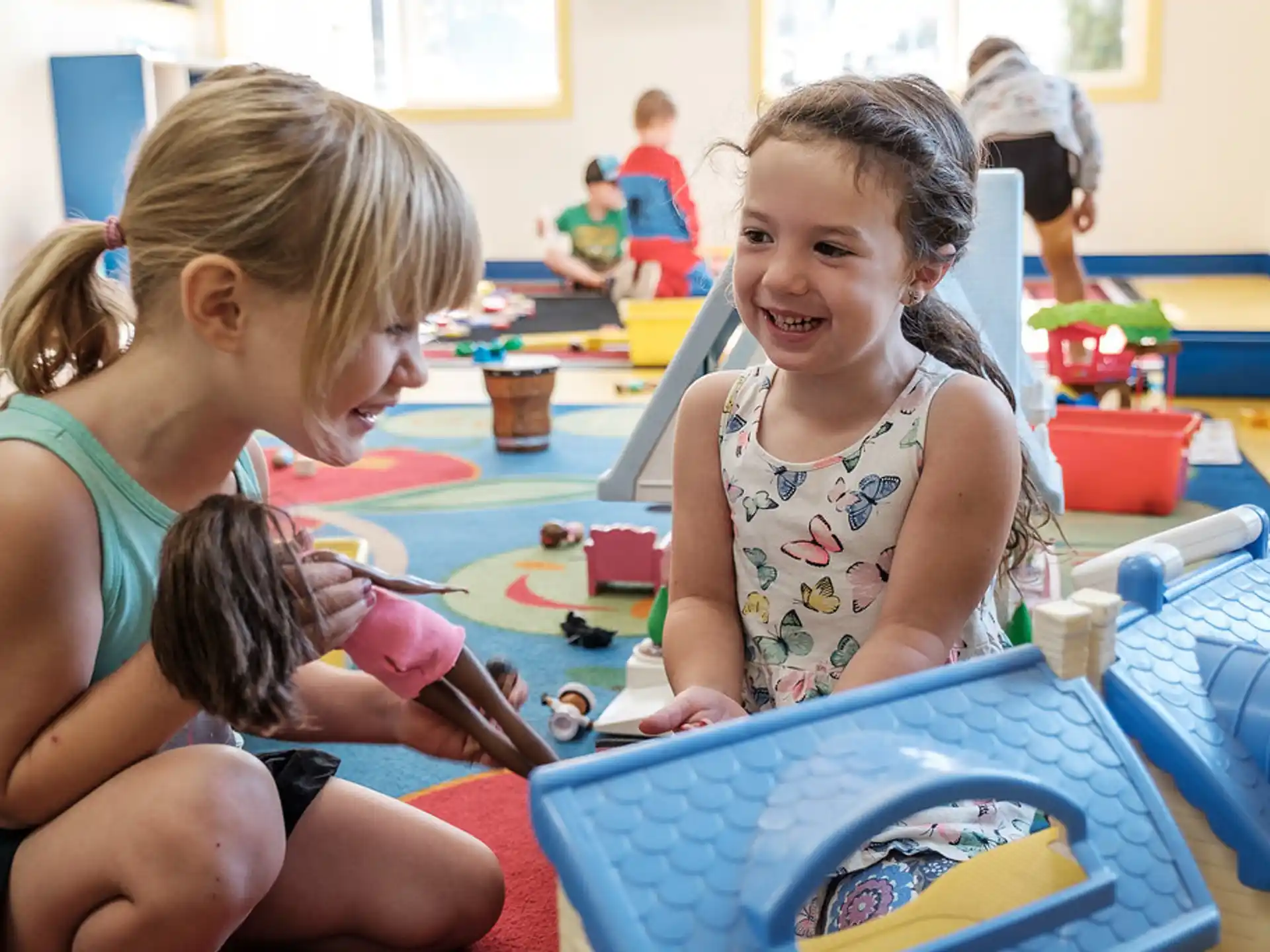a few young girls playing in a room