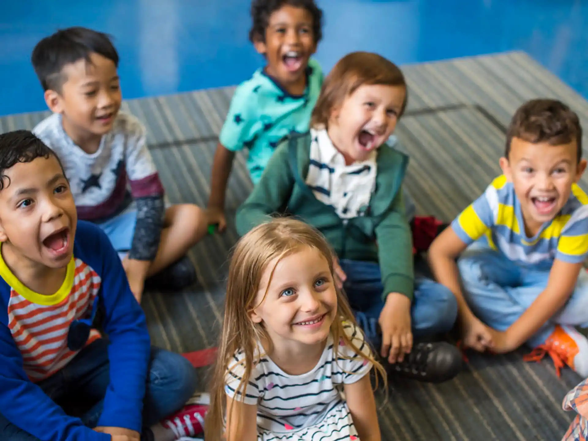 a group of children sitting on the floor