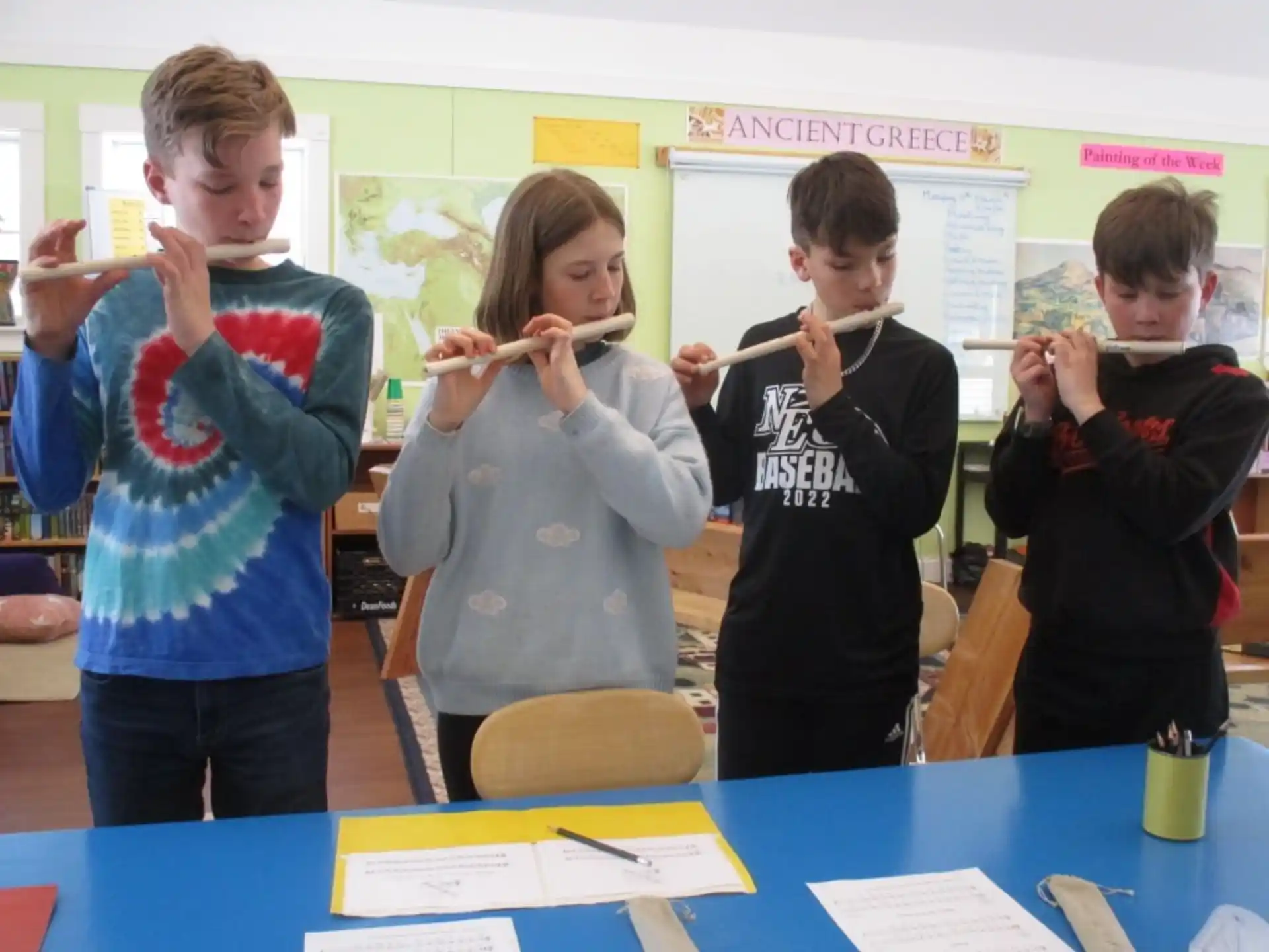 a group of kids holding tooth brushes