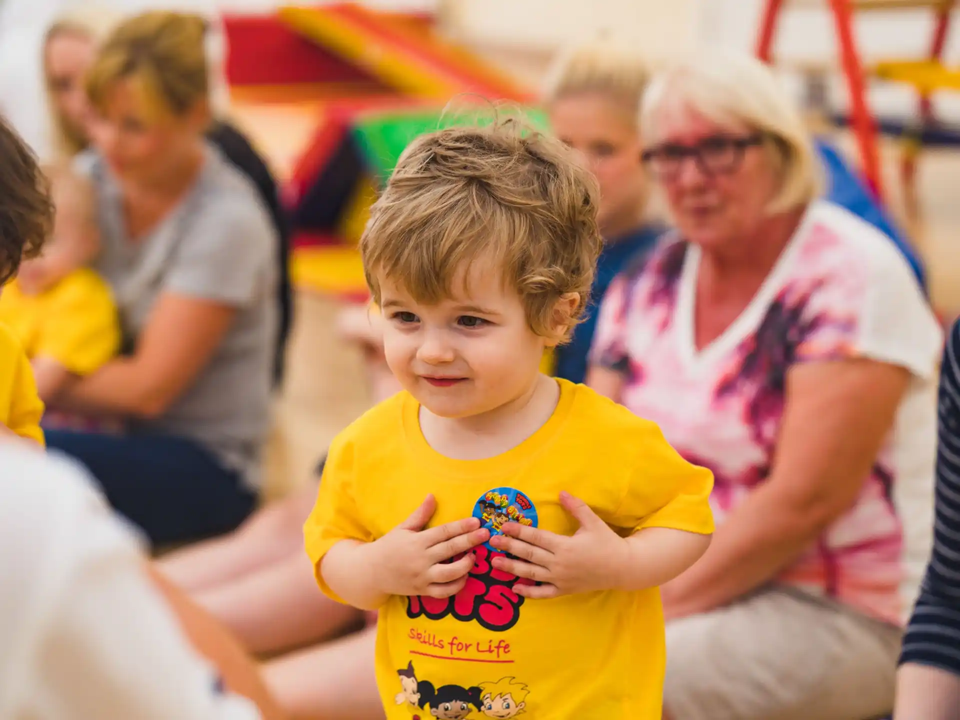 a boy in a yellow shirt